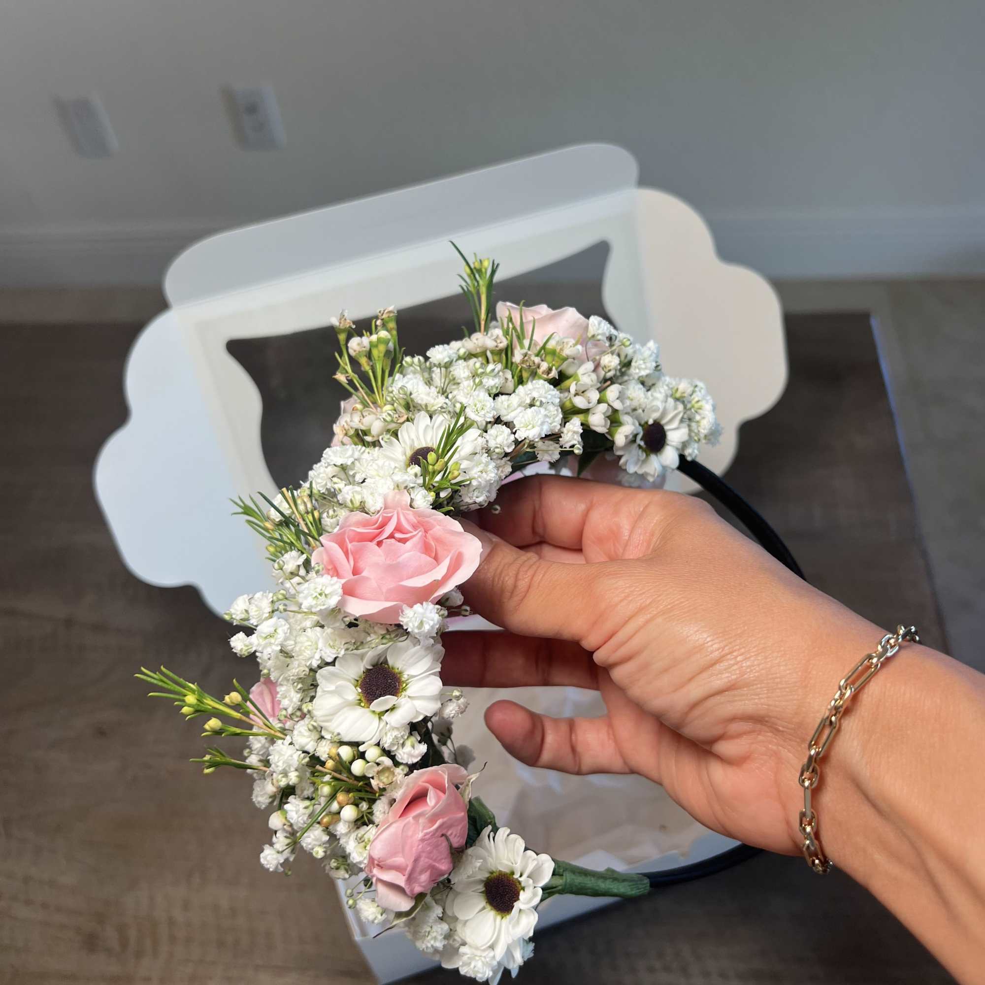Pink and white floral crown with small daisies and roses