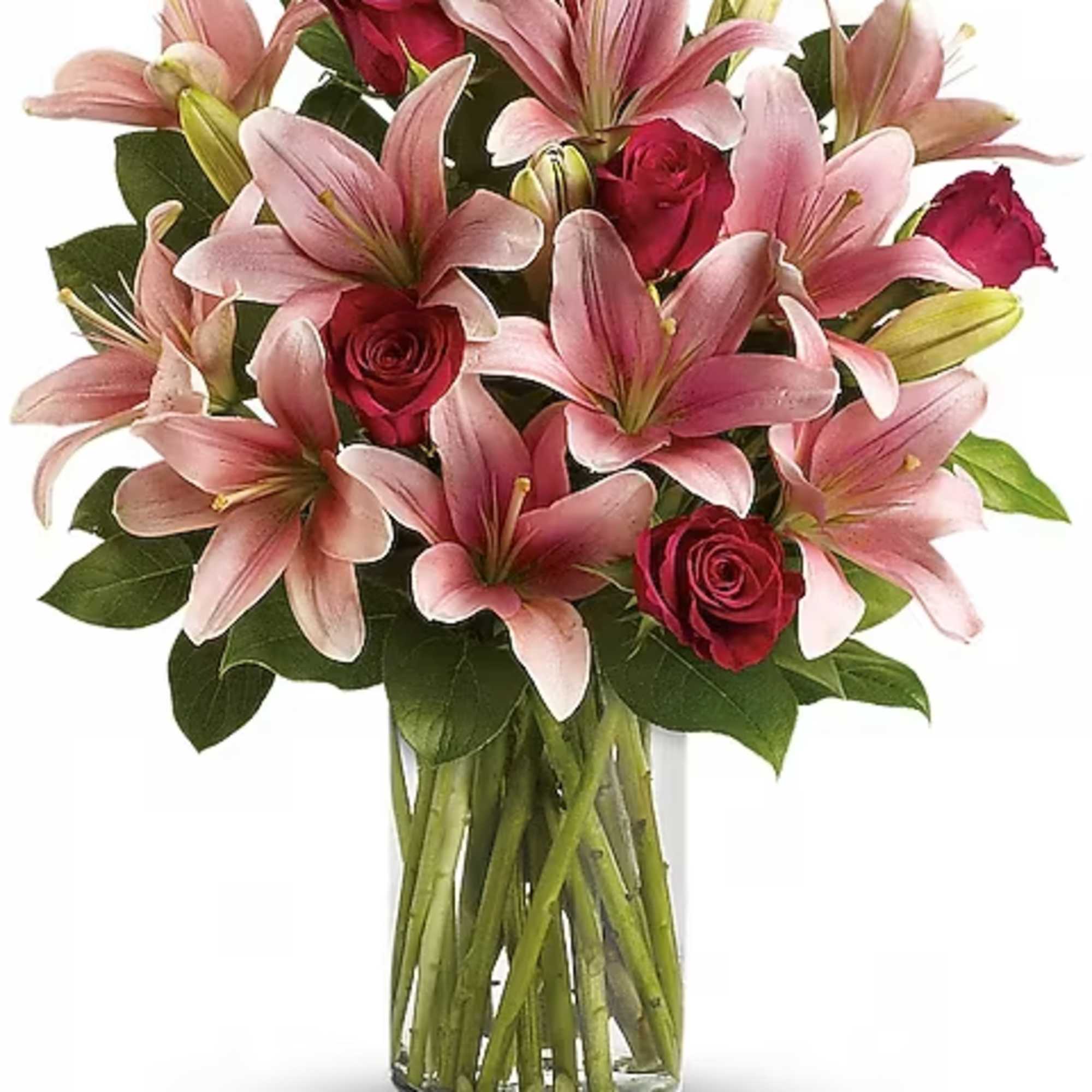 Pink lilies and red roses in a clear glass vase