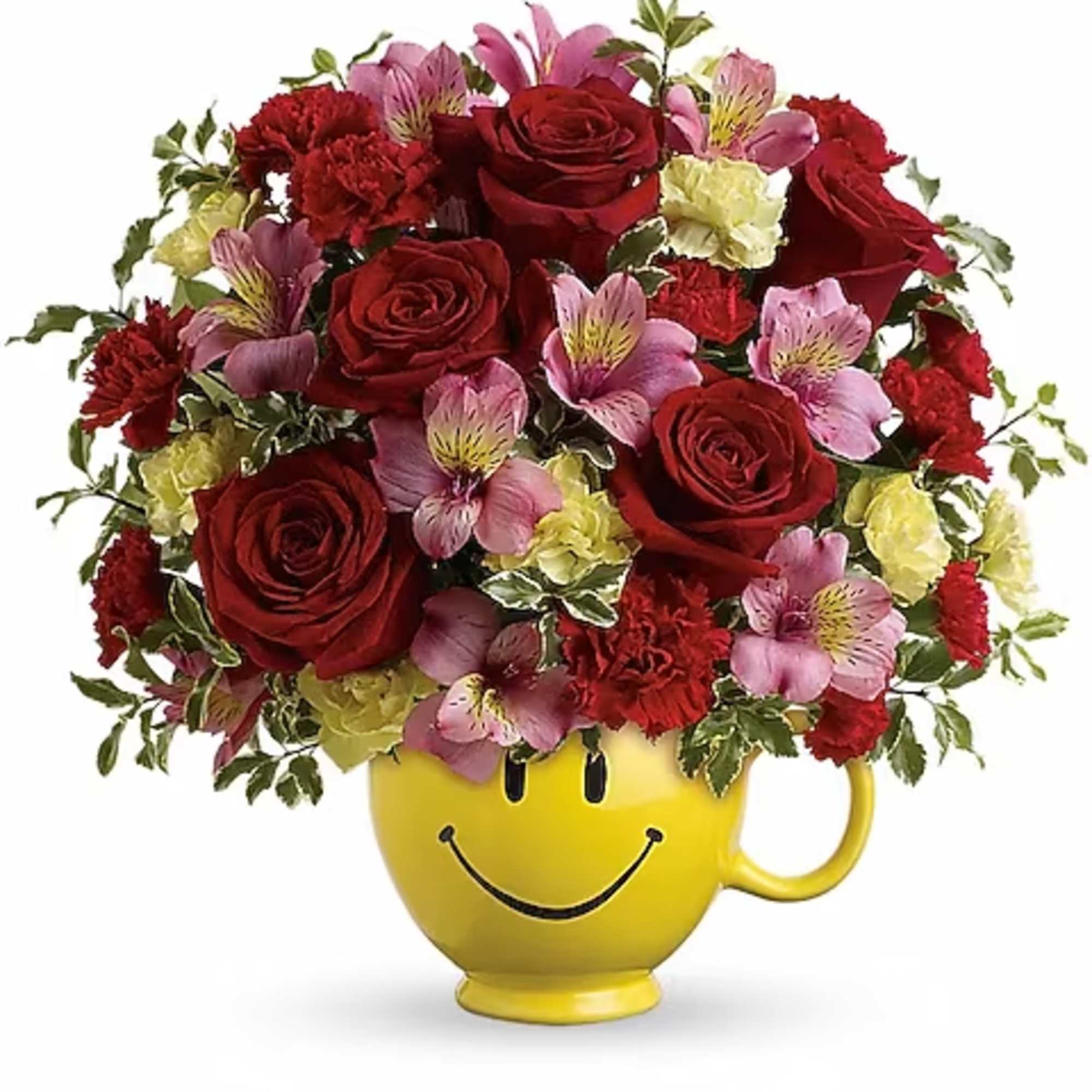 Bouquet of red roses and pink flowers in a yellow smiley-face mug