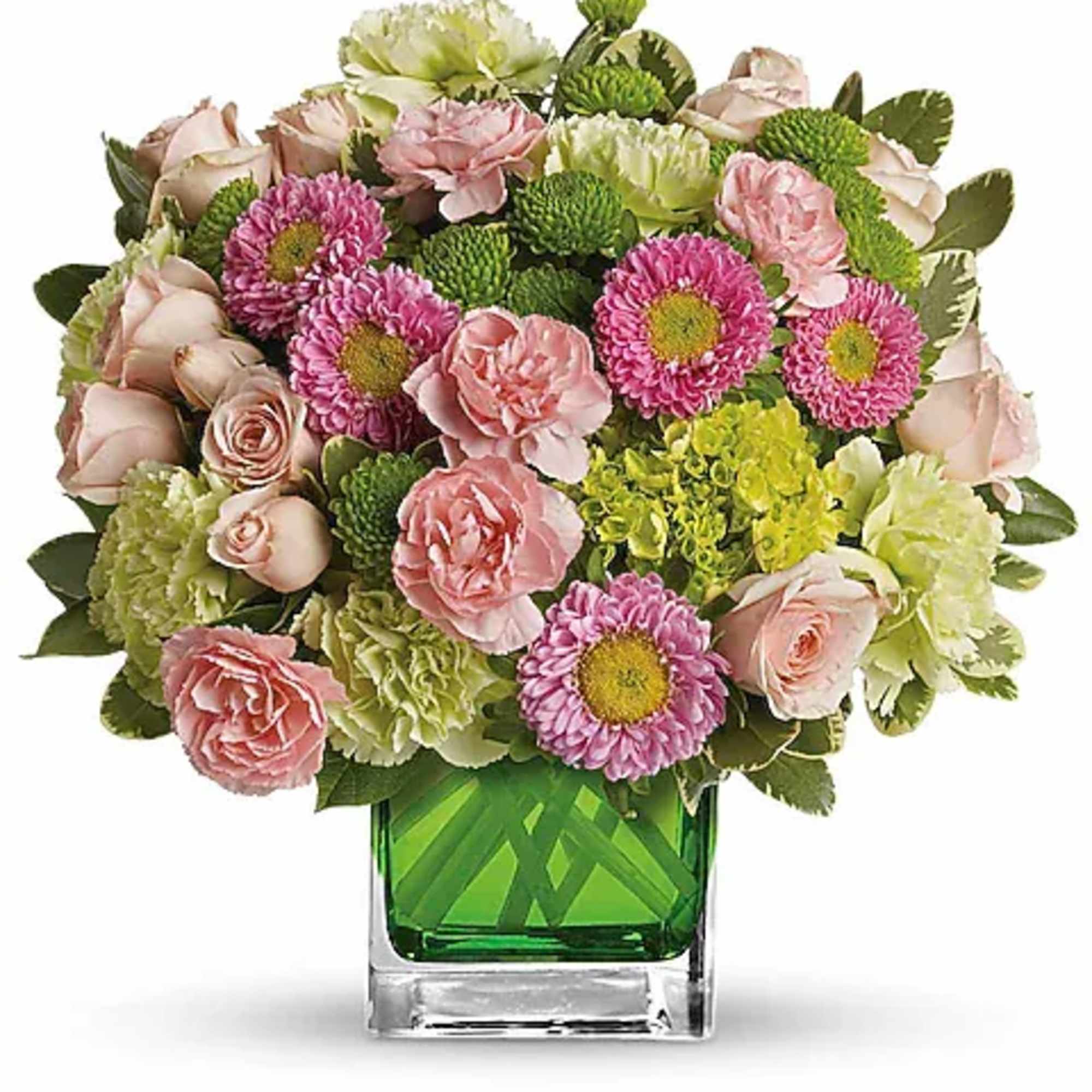 Pink and green mixed bouquet in a square glass vase