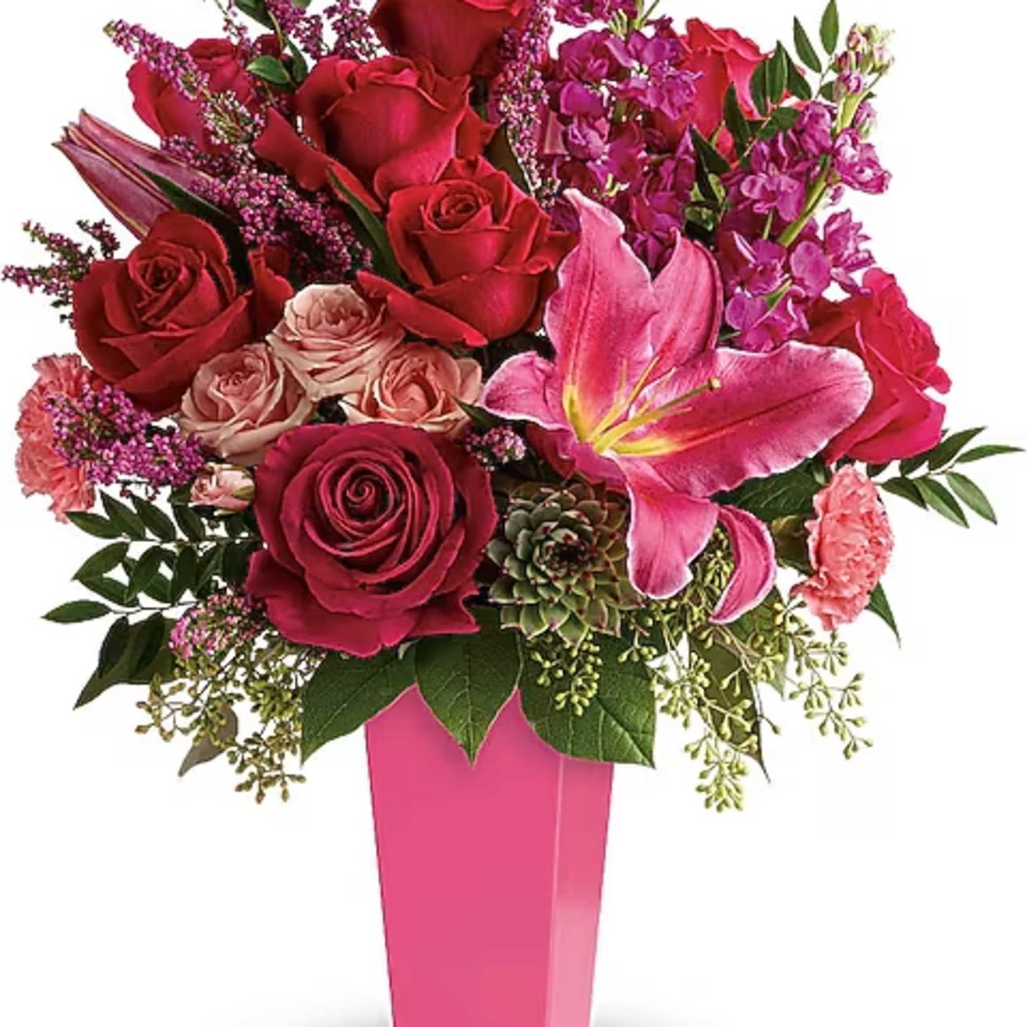Pink and red mixed bouquet in a tall pink vase