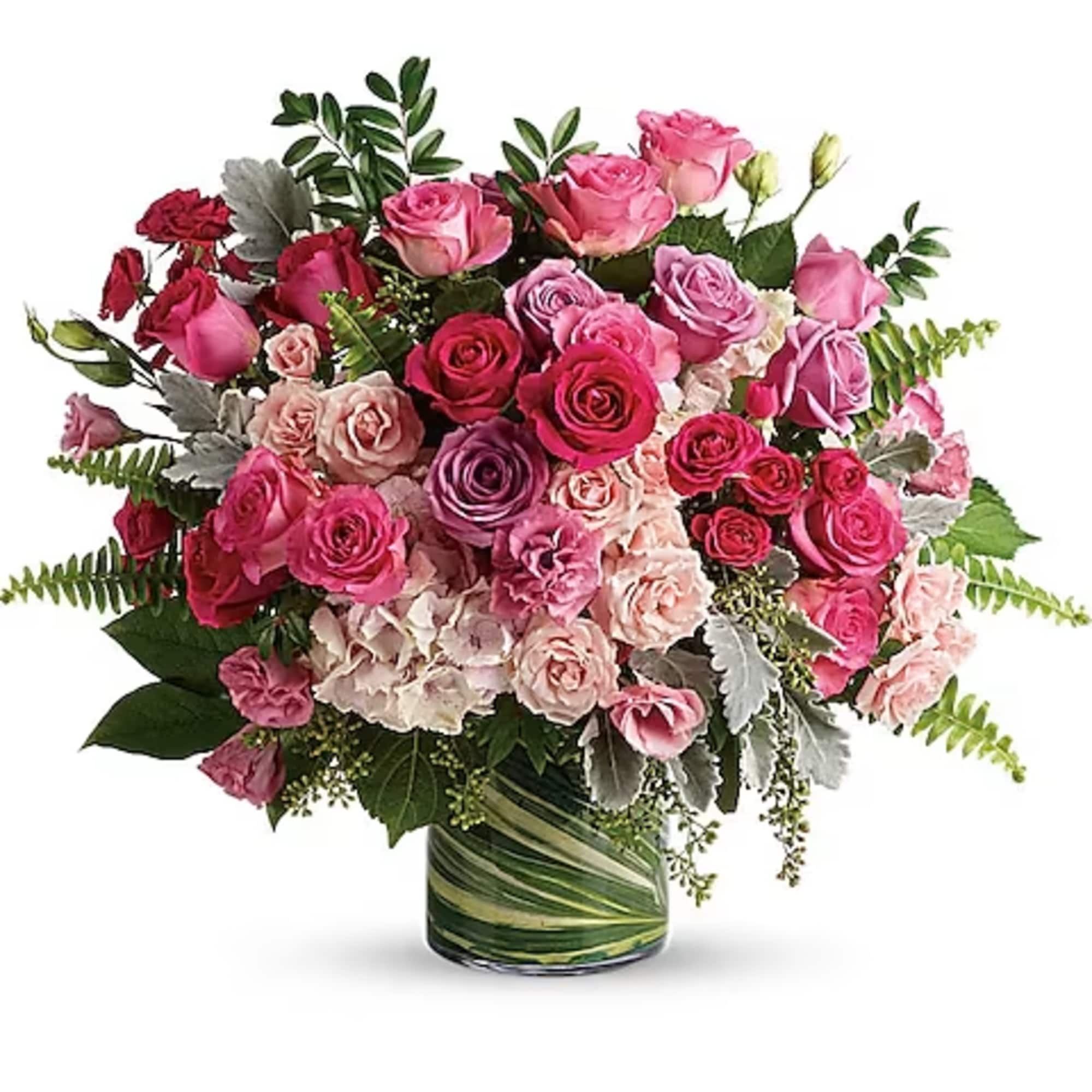 Pink and red rose bouquet in a glass vase