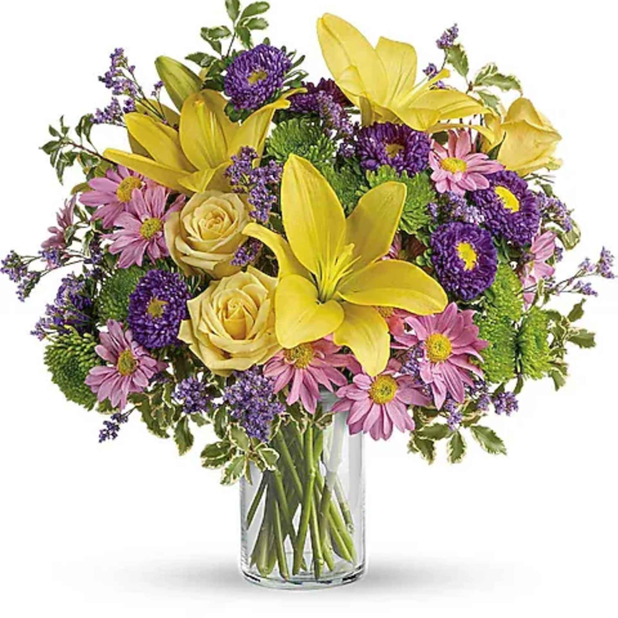 Bouquet of yellow lilies, pink daisies, and purple flowers in a glass vase