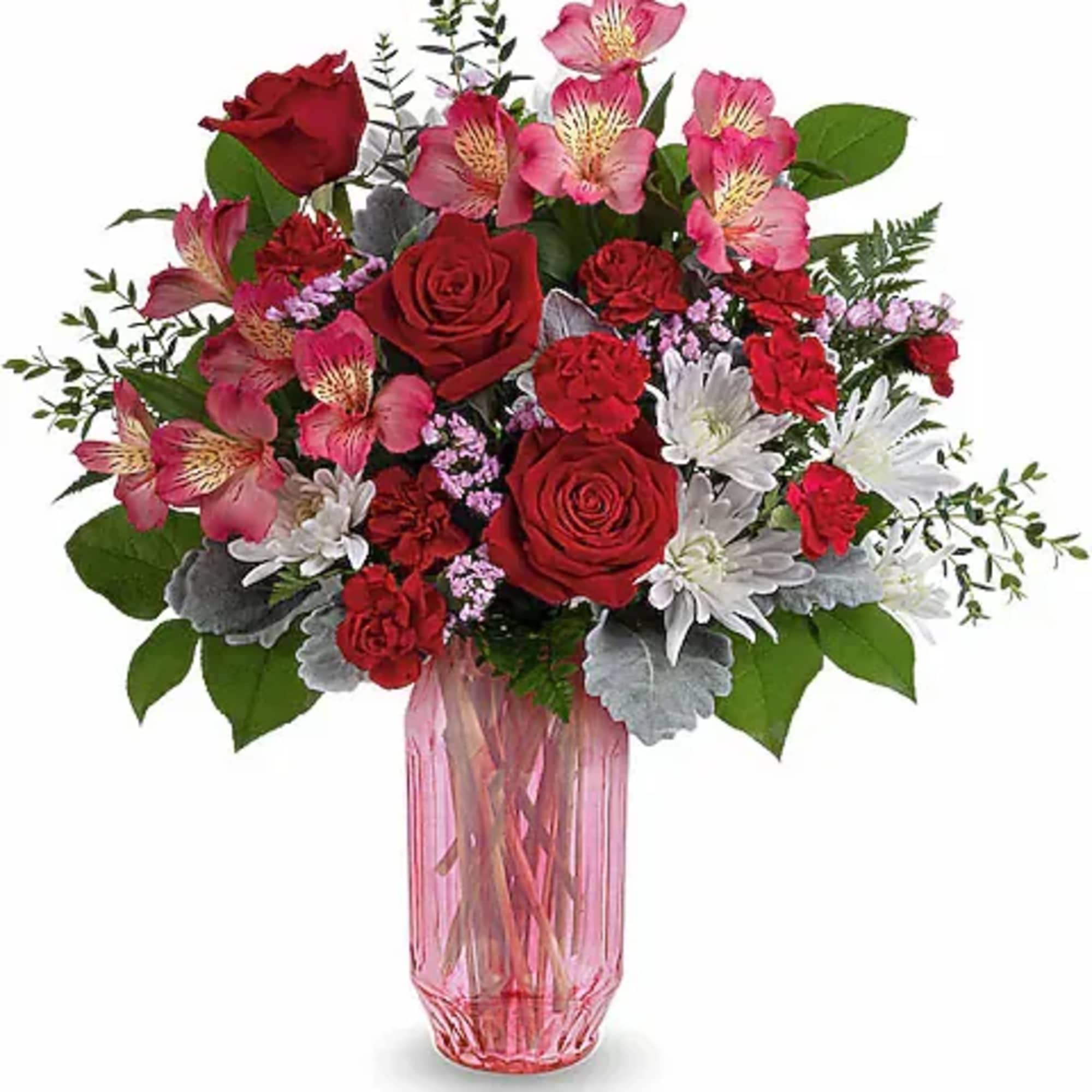 Red and pink mixed bouquet in a pink glass vase