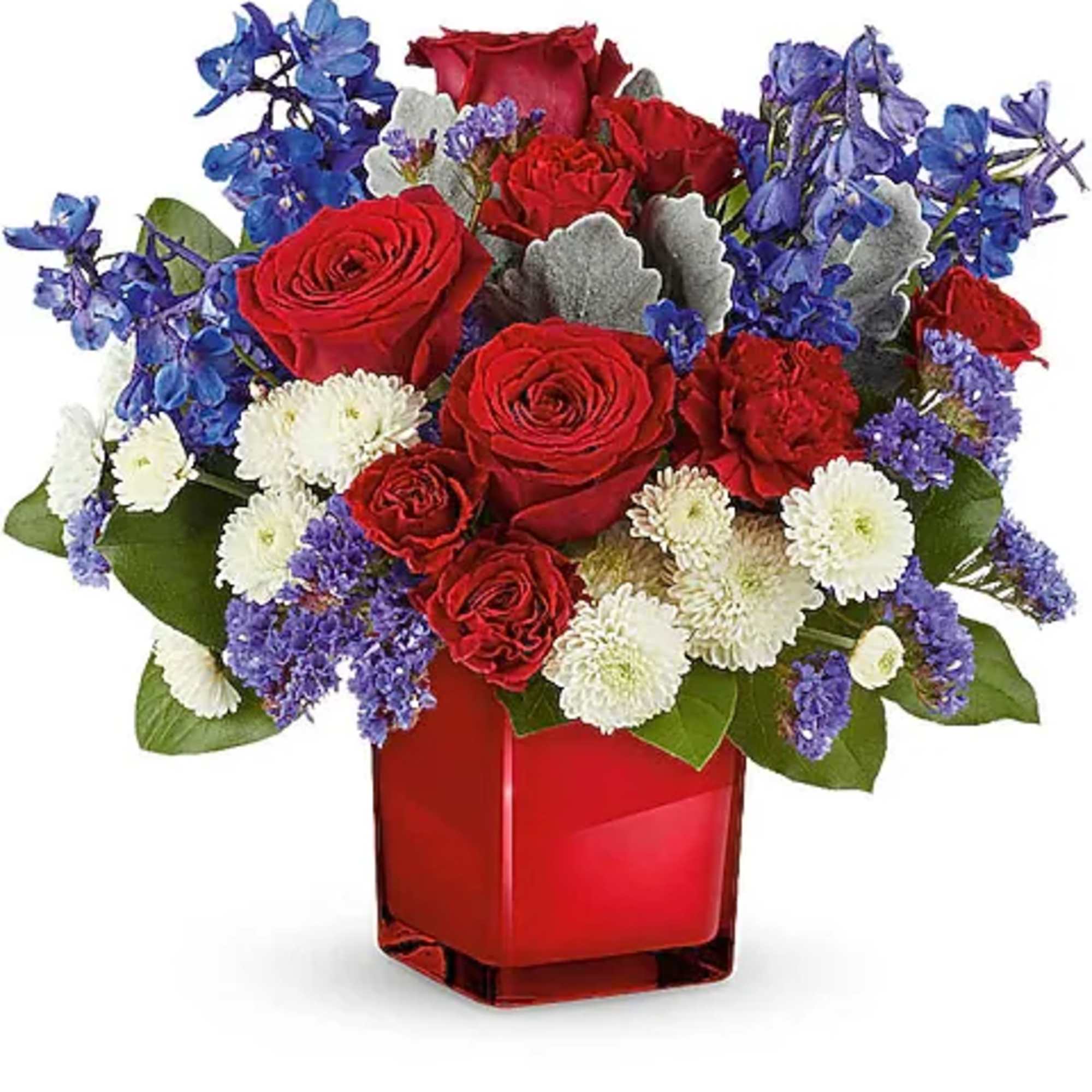 Red roses and white daisies in a red square vase with blue flowers