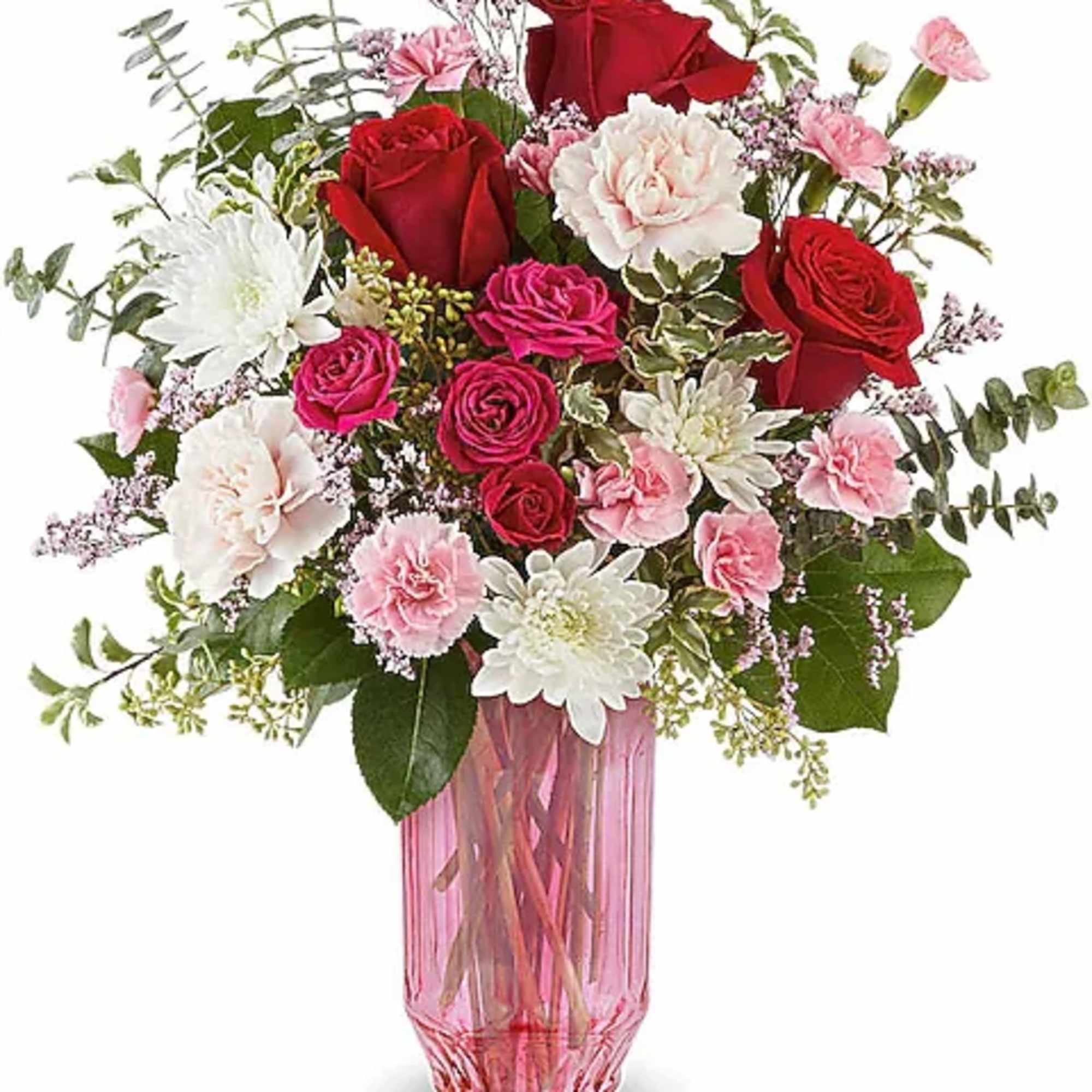 Pink and red rose bouquet in a tall pink glass vase