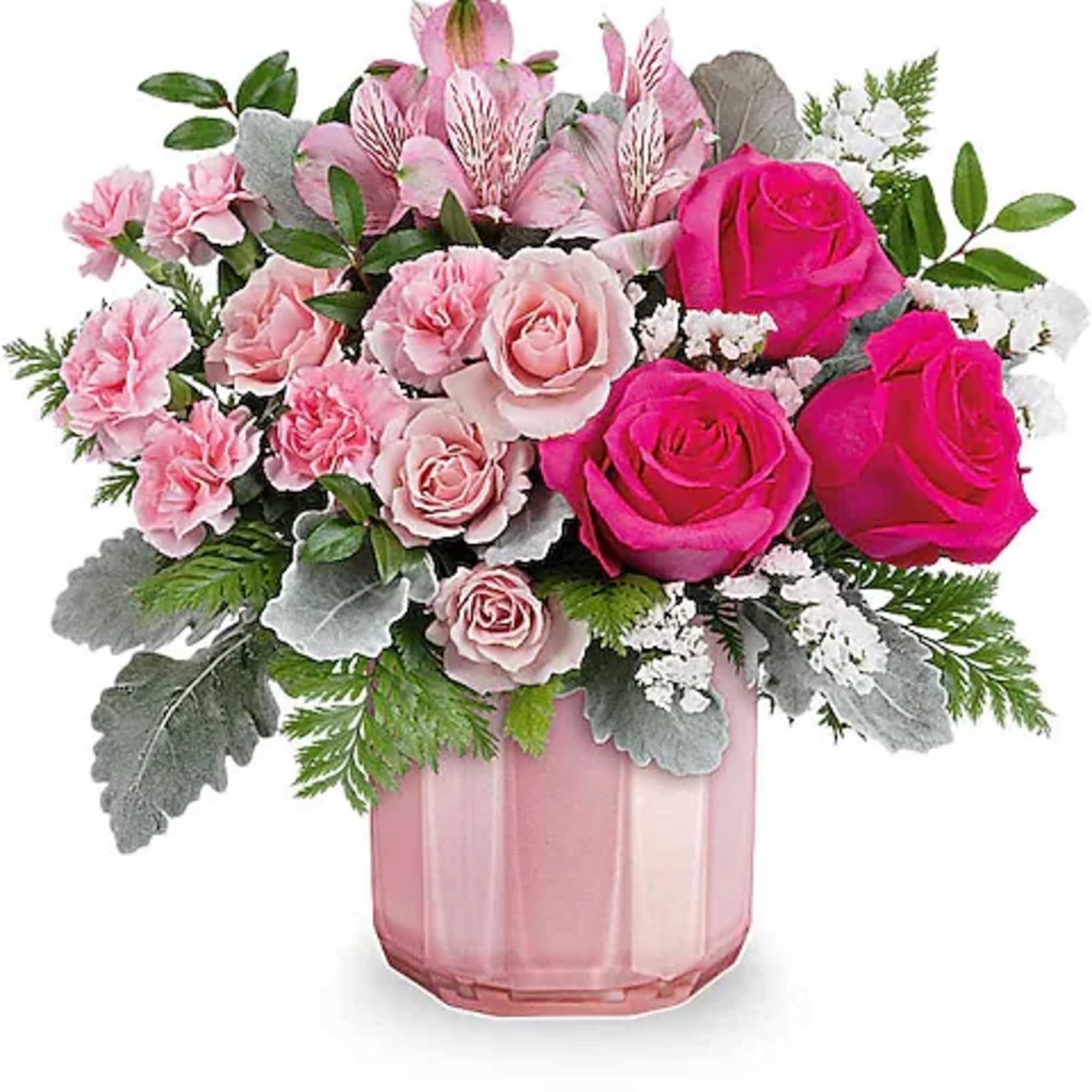 Pink roses and carnations in a pink glass vase