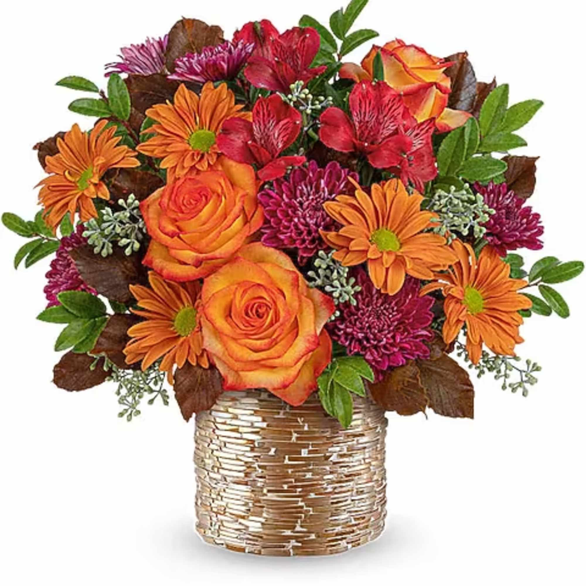 Bouquet of orange and red flowers in a woven basket vase