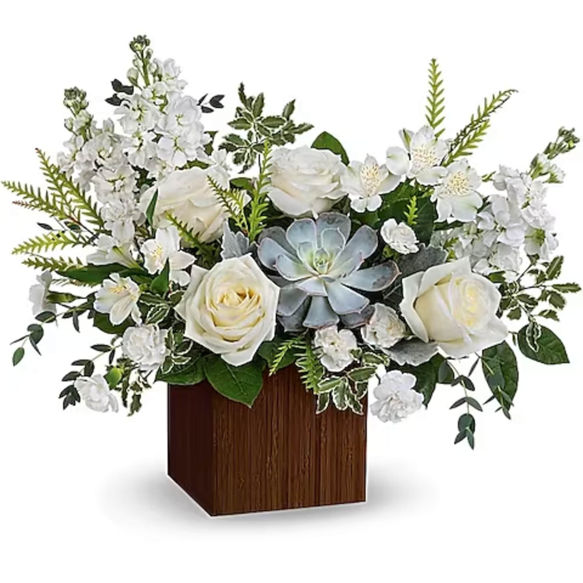 White roses and orchids arranged in a wooden cube vase with a succulent centerpiece