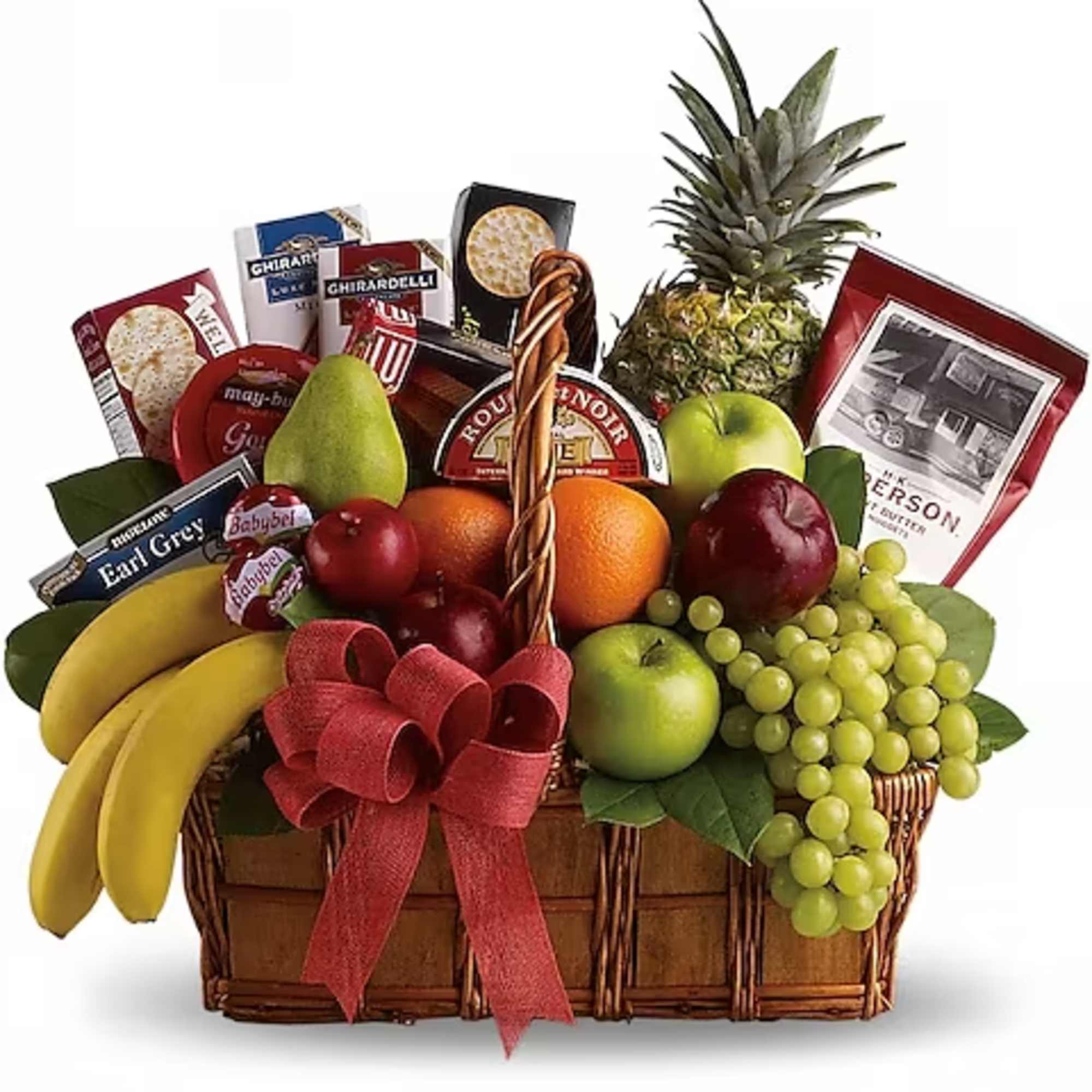 Fruit basket with bananas, grapes, apples, pineapple, and candy boxes