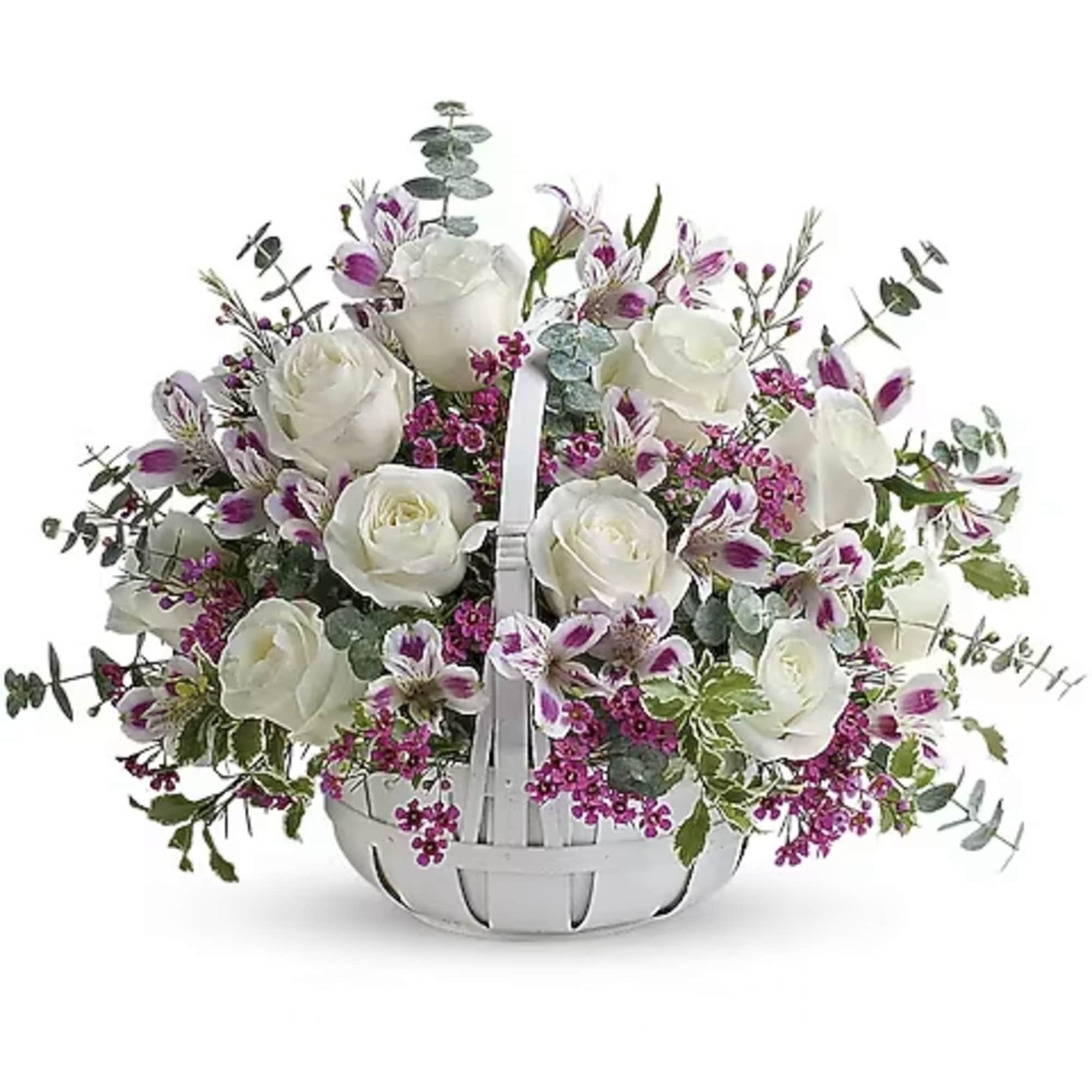 White roses and purple flowers in a white basket