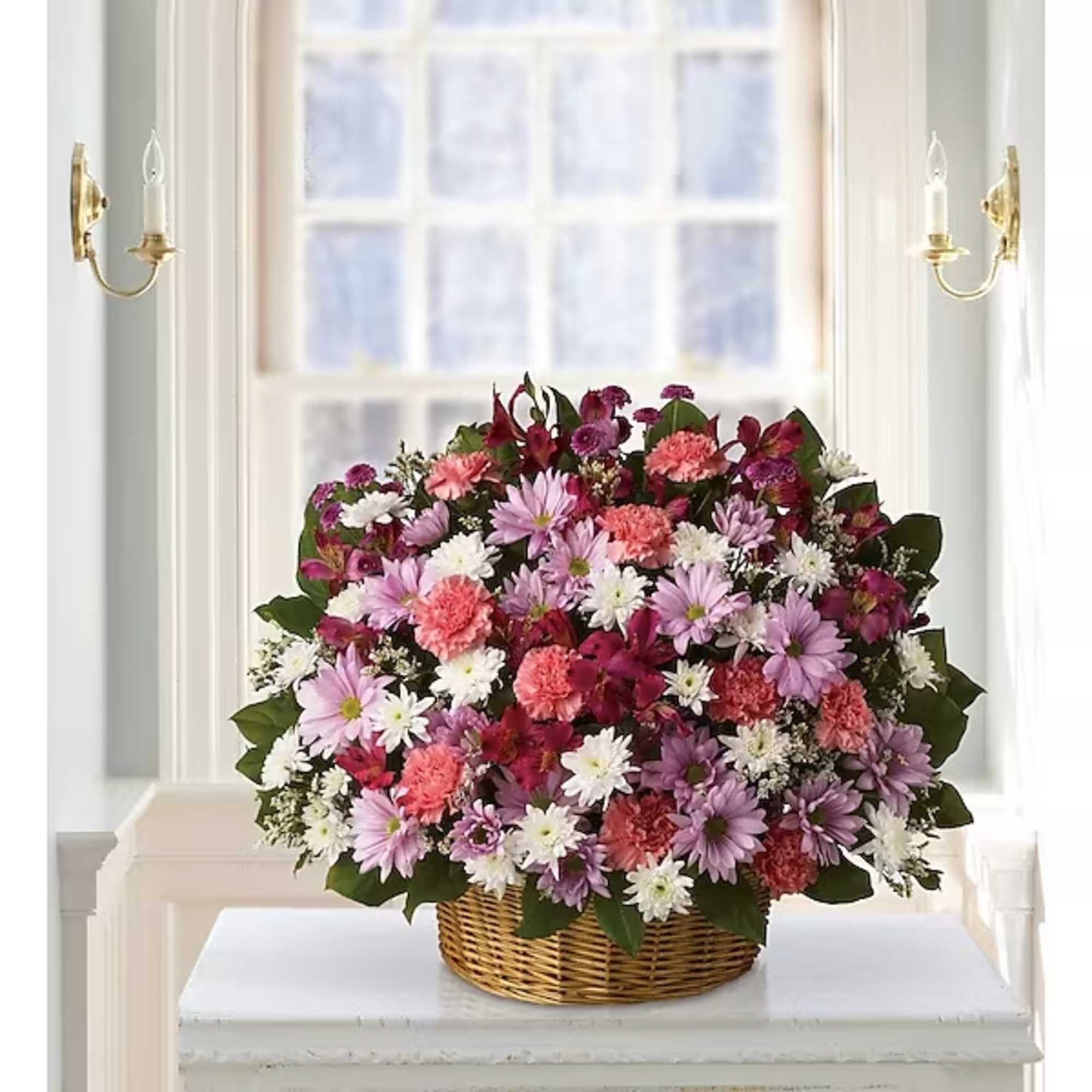 Basket of pink, purple, and white mixed flowers