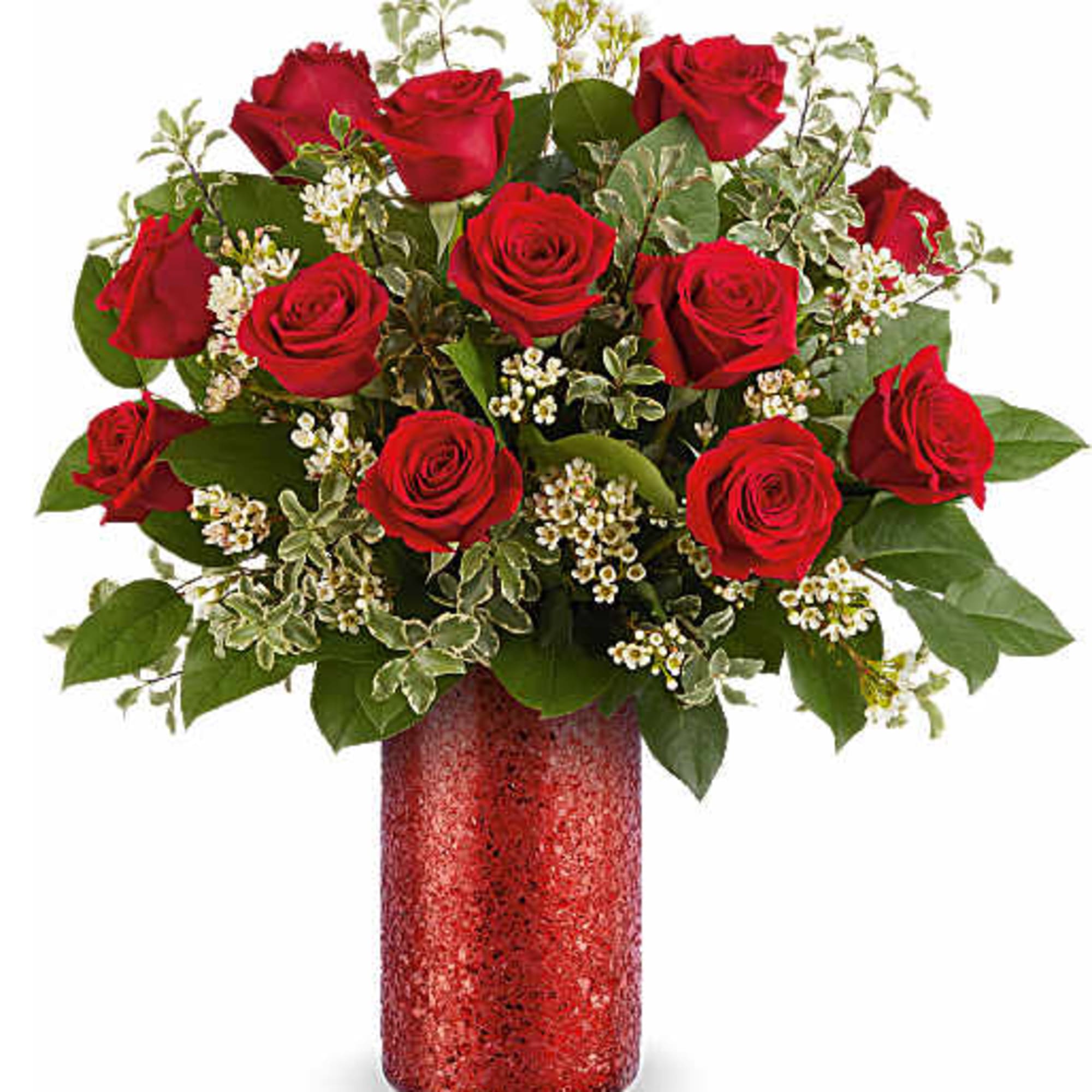 Red roses arranged in a red glitter vase