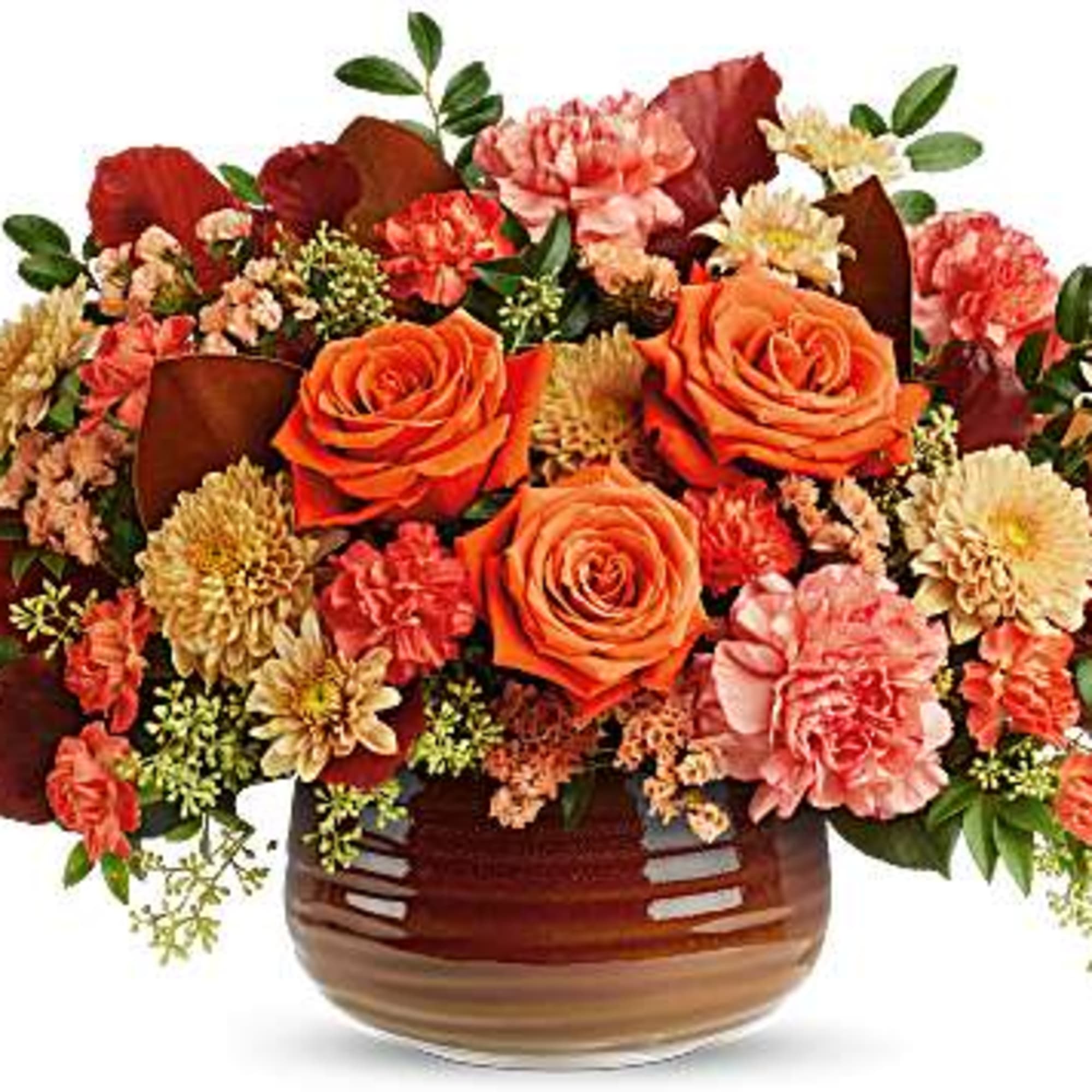 Orange roses and mixed fall flowers arranged in a brown ceramic vase