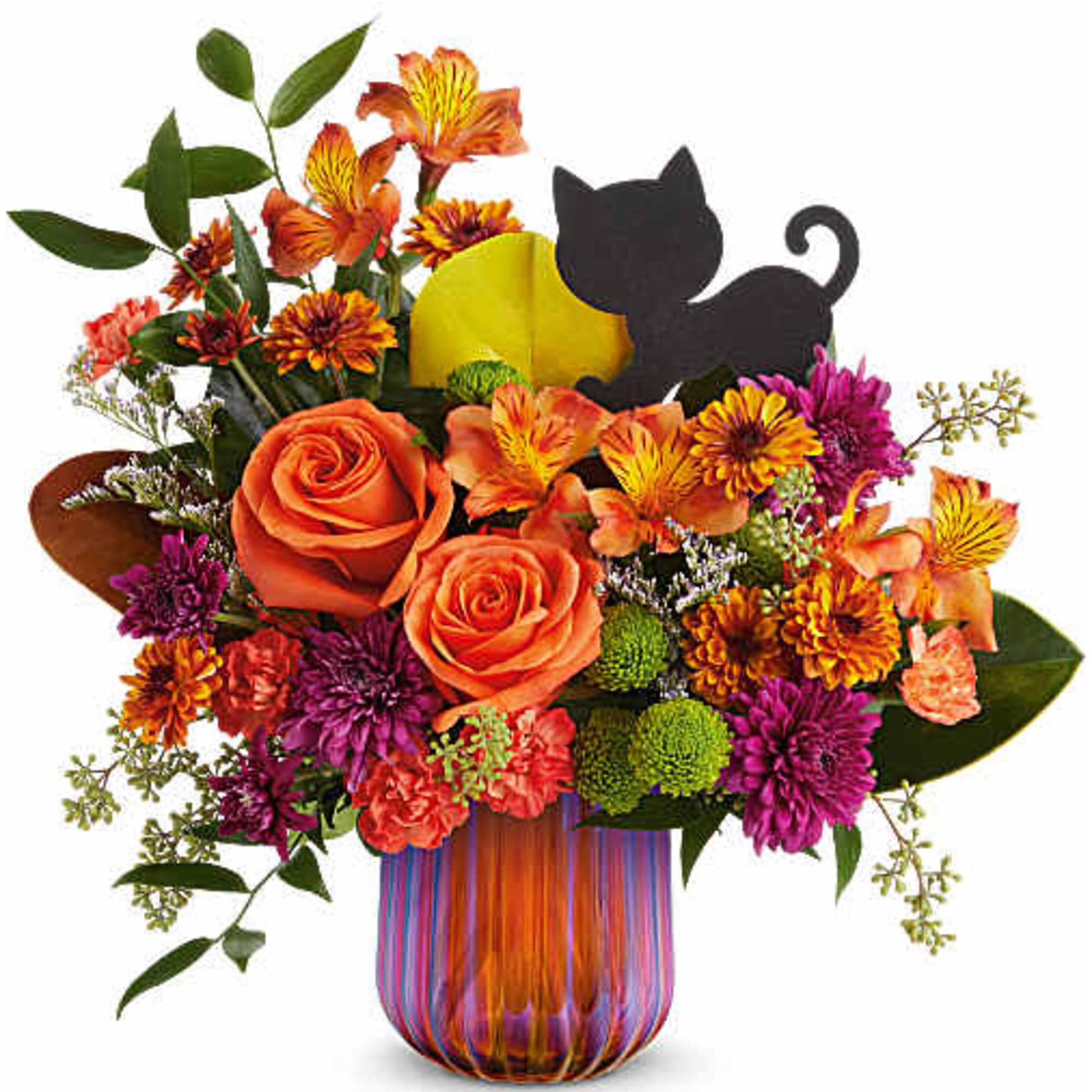 Orange and purple flower arrangement in a striped glass vase with a black cat decoration