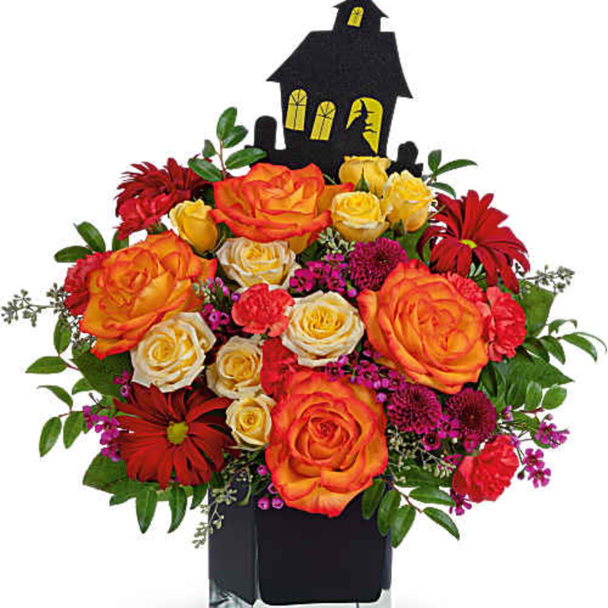 Halloween bouquet with orange and red roses in a black vase topped by a haunted house decoration
