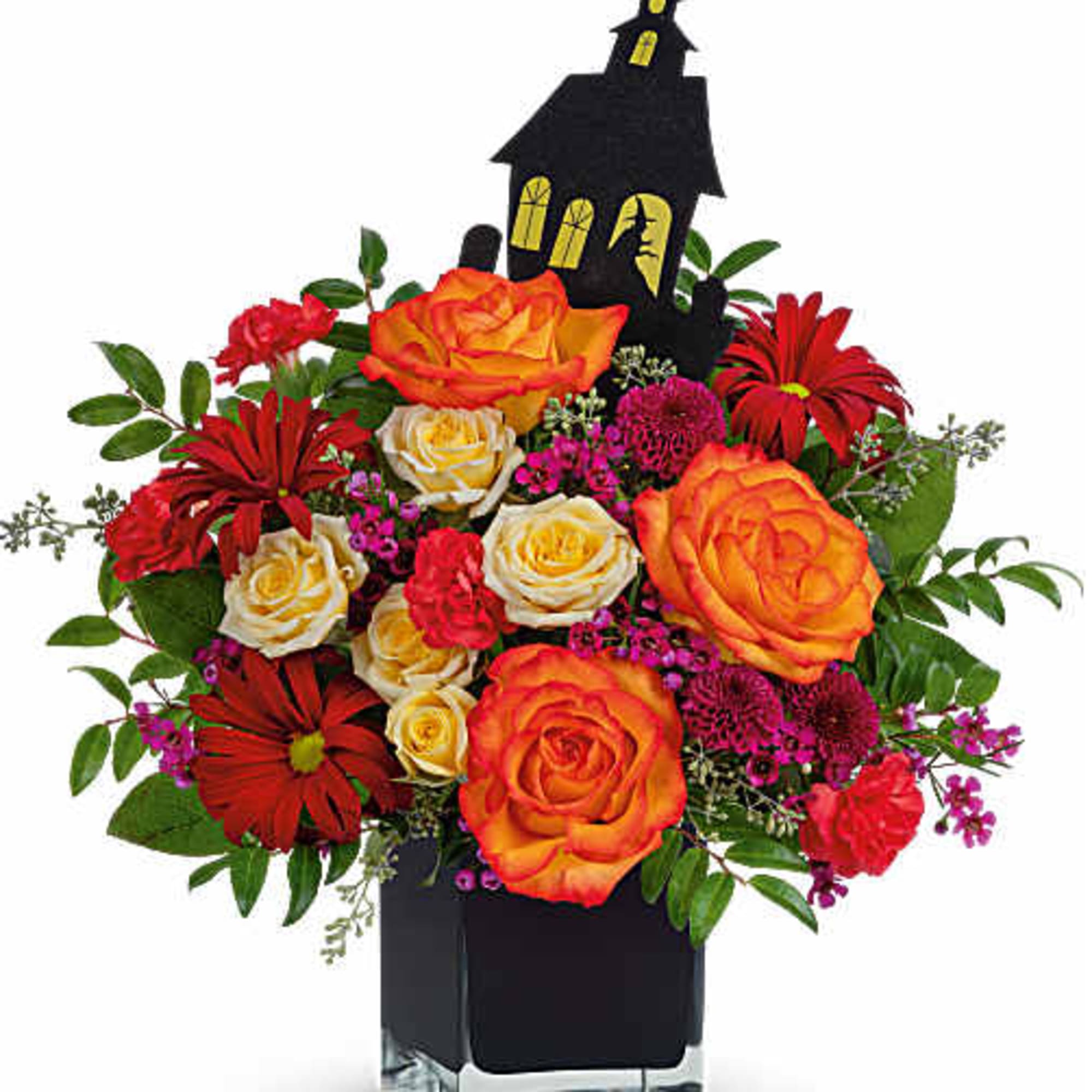 Halloween bouquet with orange and red roses in a black vase, topped with a haunted house pick