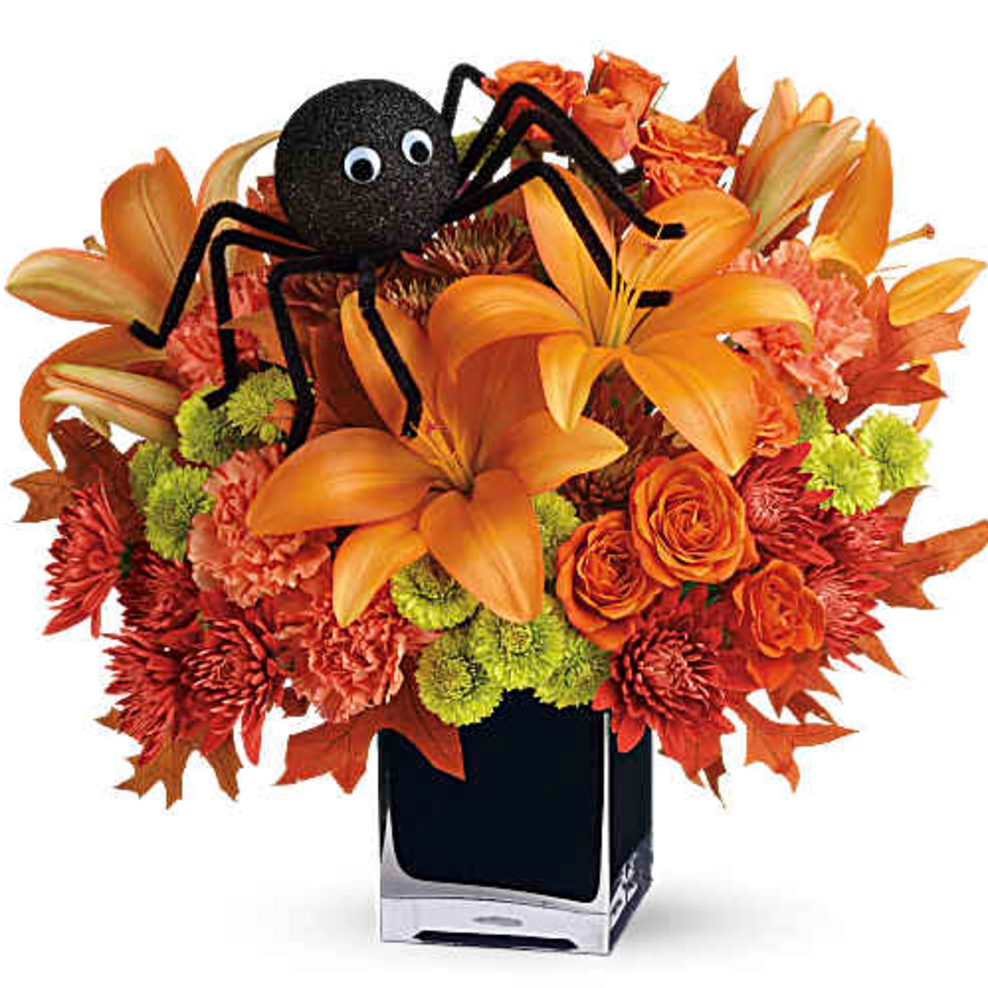 Orange floral arrangement with a black spider decoration in a square vase