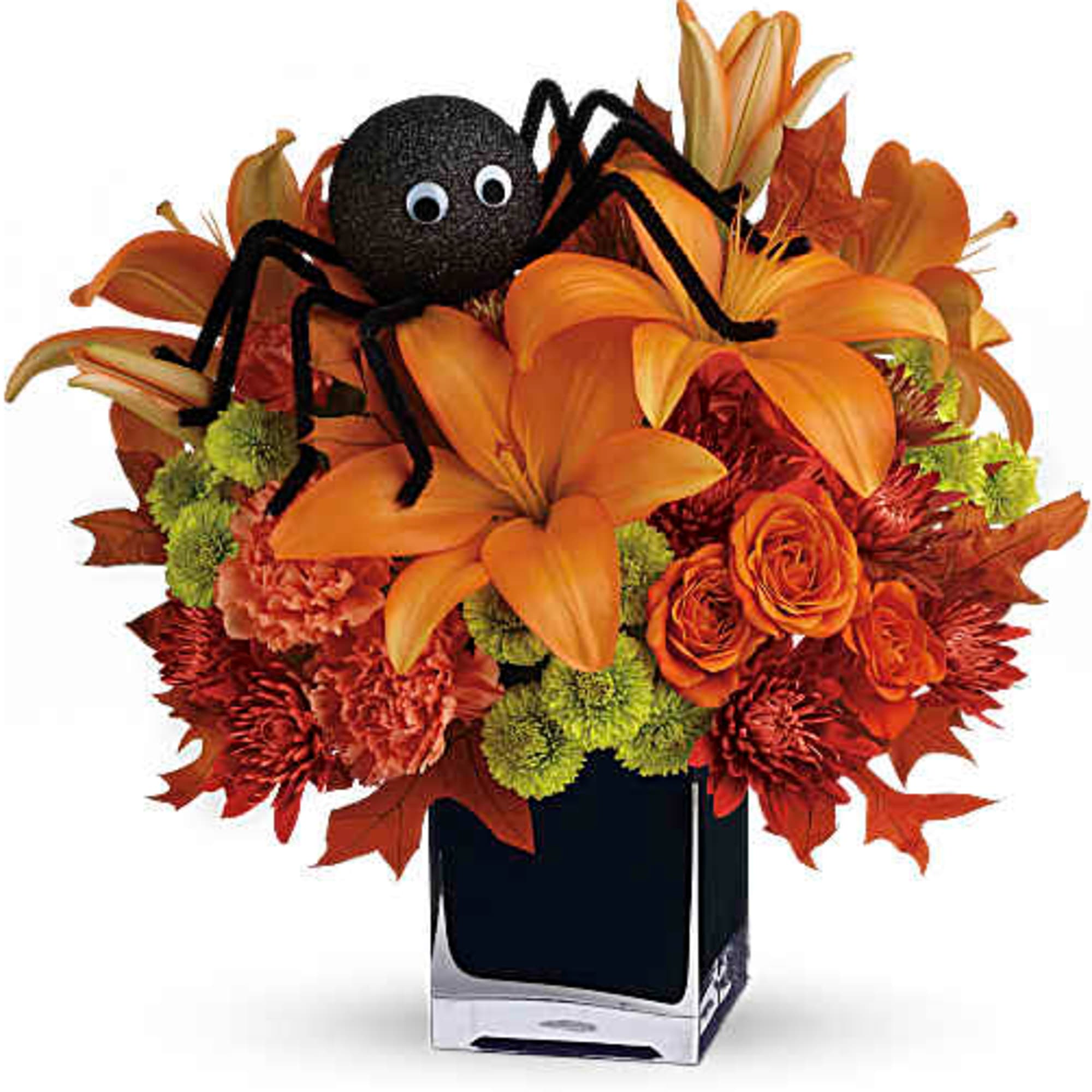 Orange floral arrangement with a decorative spider in a square vase