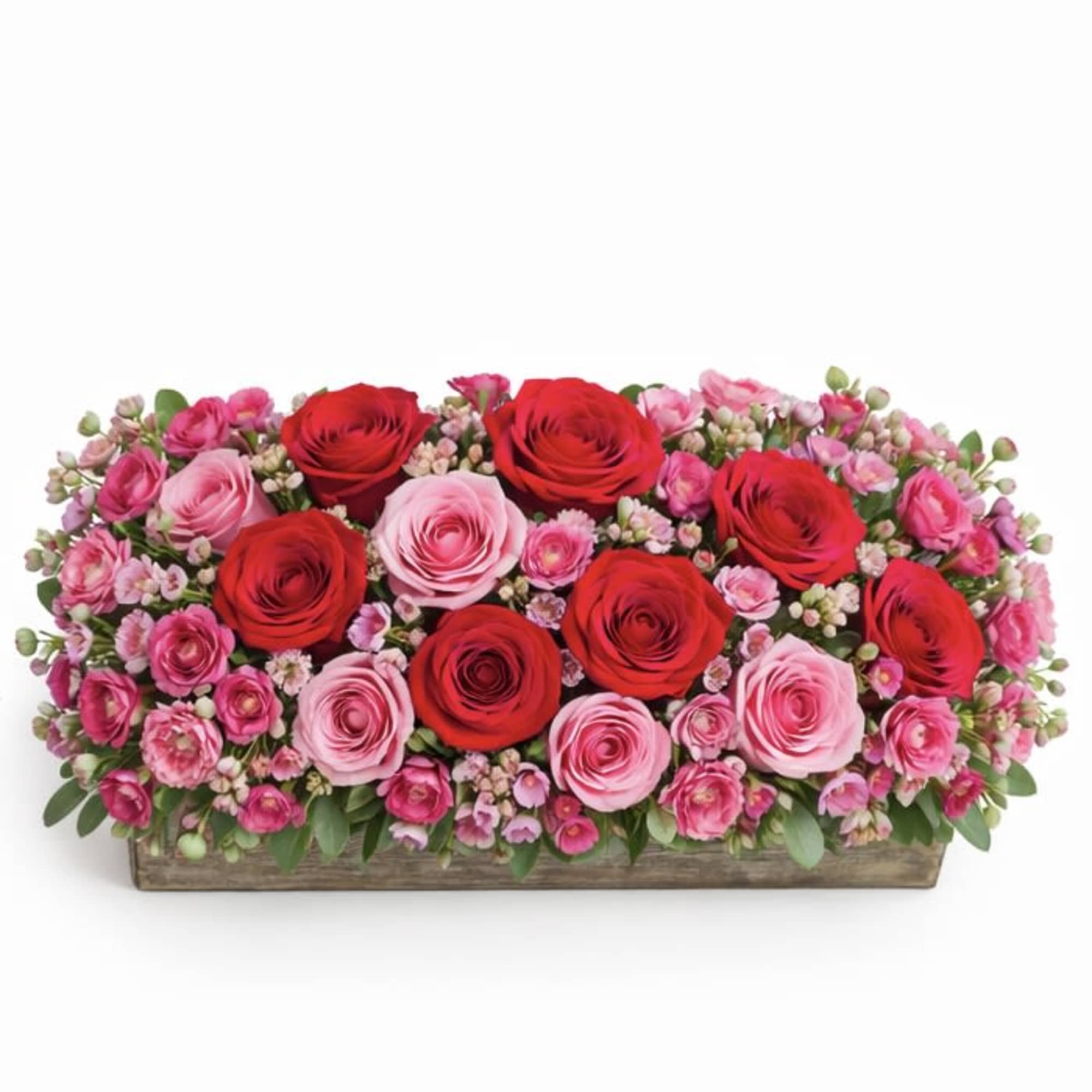 Rectangular arrangement of red and pink roses in a wooden box