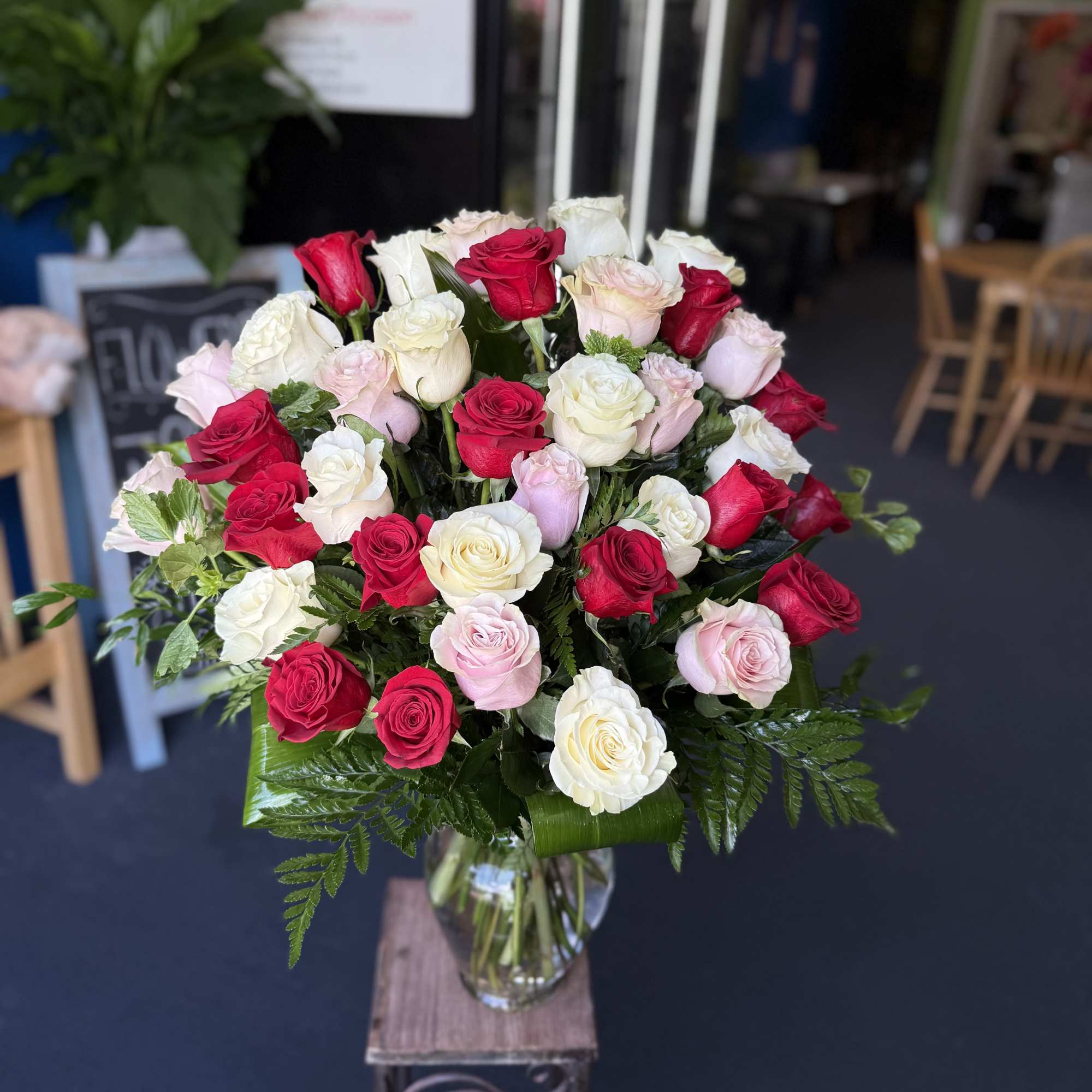 (ALL-ROUND) A 36 full, elegant arrangement of red, white, and light pink
