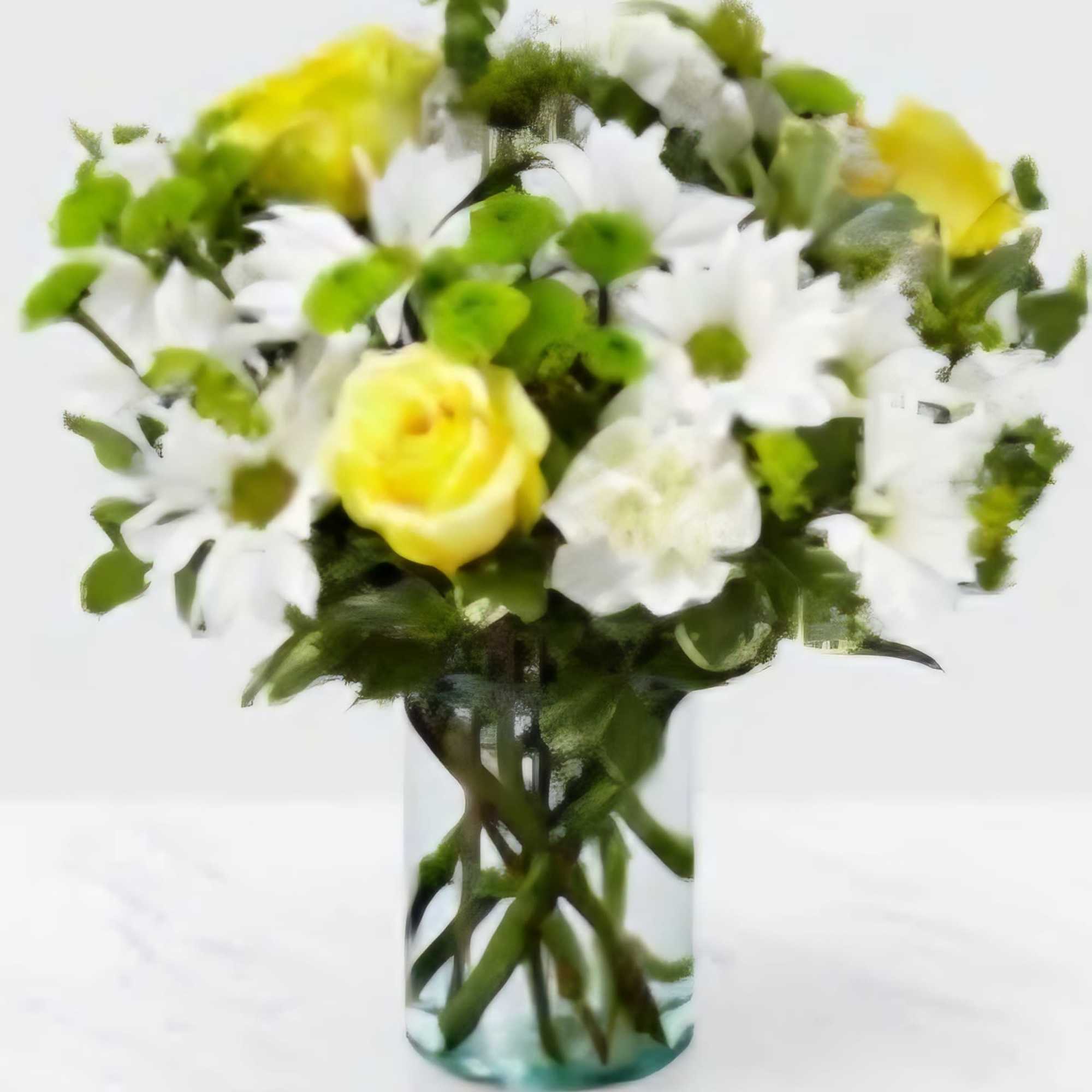 Yellow roses and white daisies in a clear glass vase