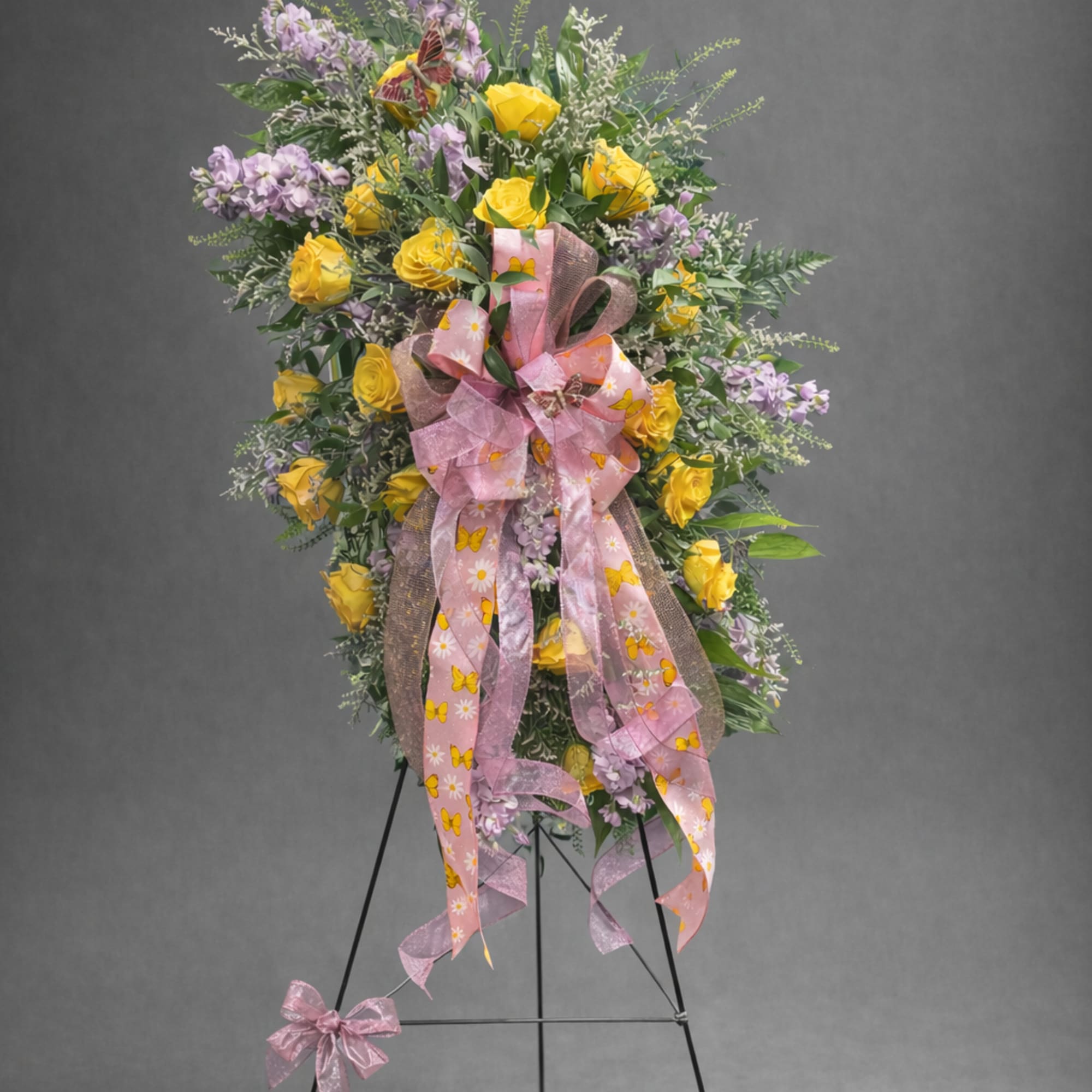 Yellow roses with a little of lavender stock and greenery on a, photo 2 of 2