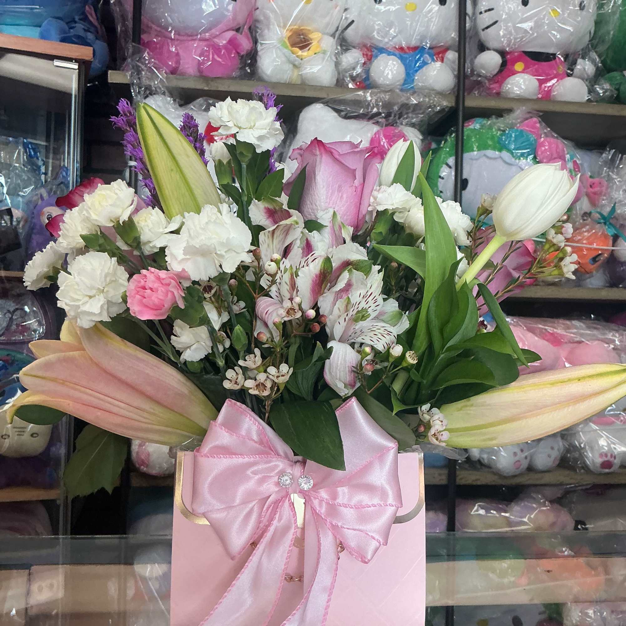 This elegant pink handbag with all of mix flowers is made of
