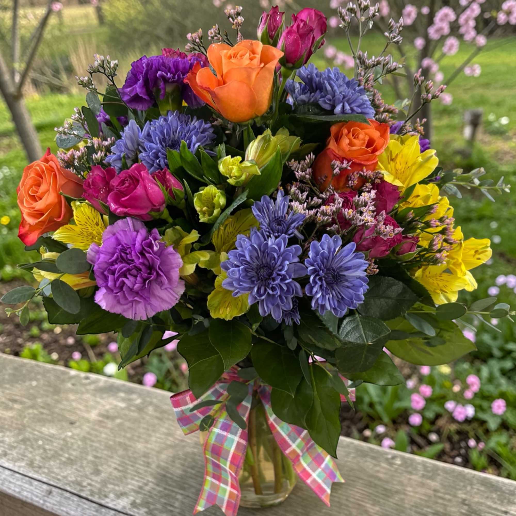 Color lovers, this one&rsquo;s for you. Bursting with vibrant orange roses, bold