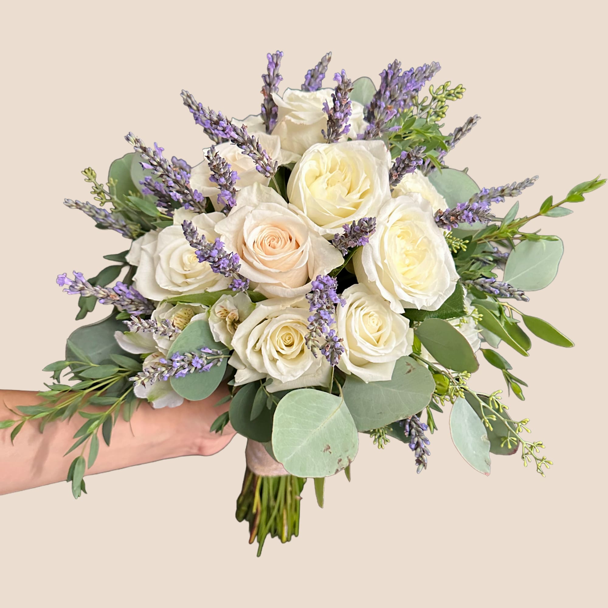 Bouquet of white roses and purple lavender with eucalyptus