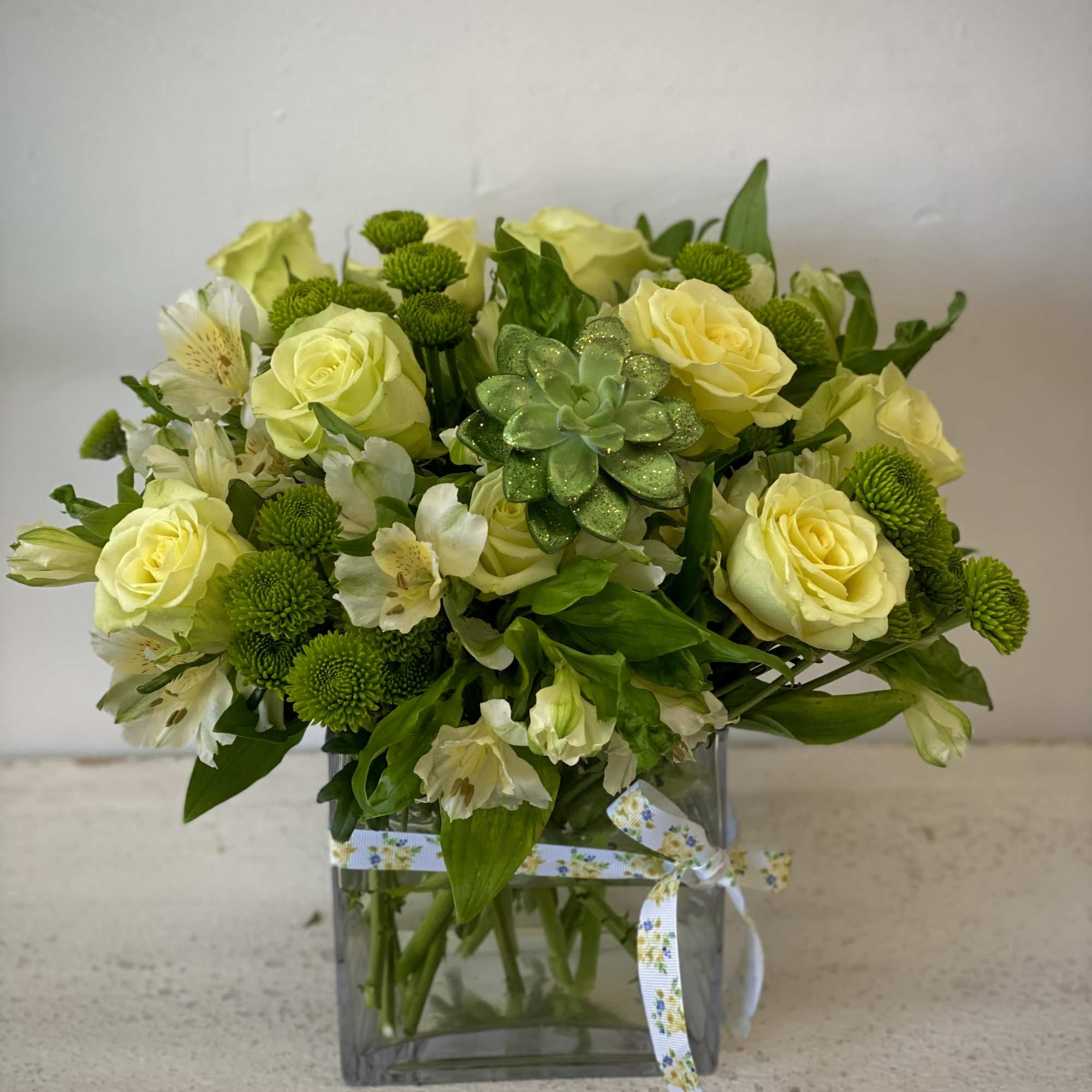 Stunning shades of green mixed in a beautiful arrangement. Perfect for any
