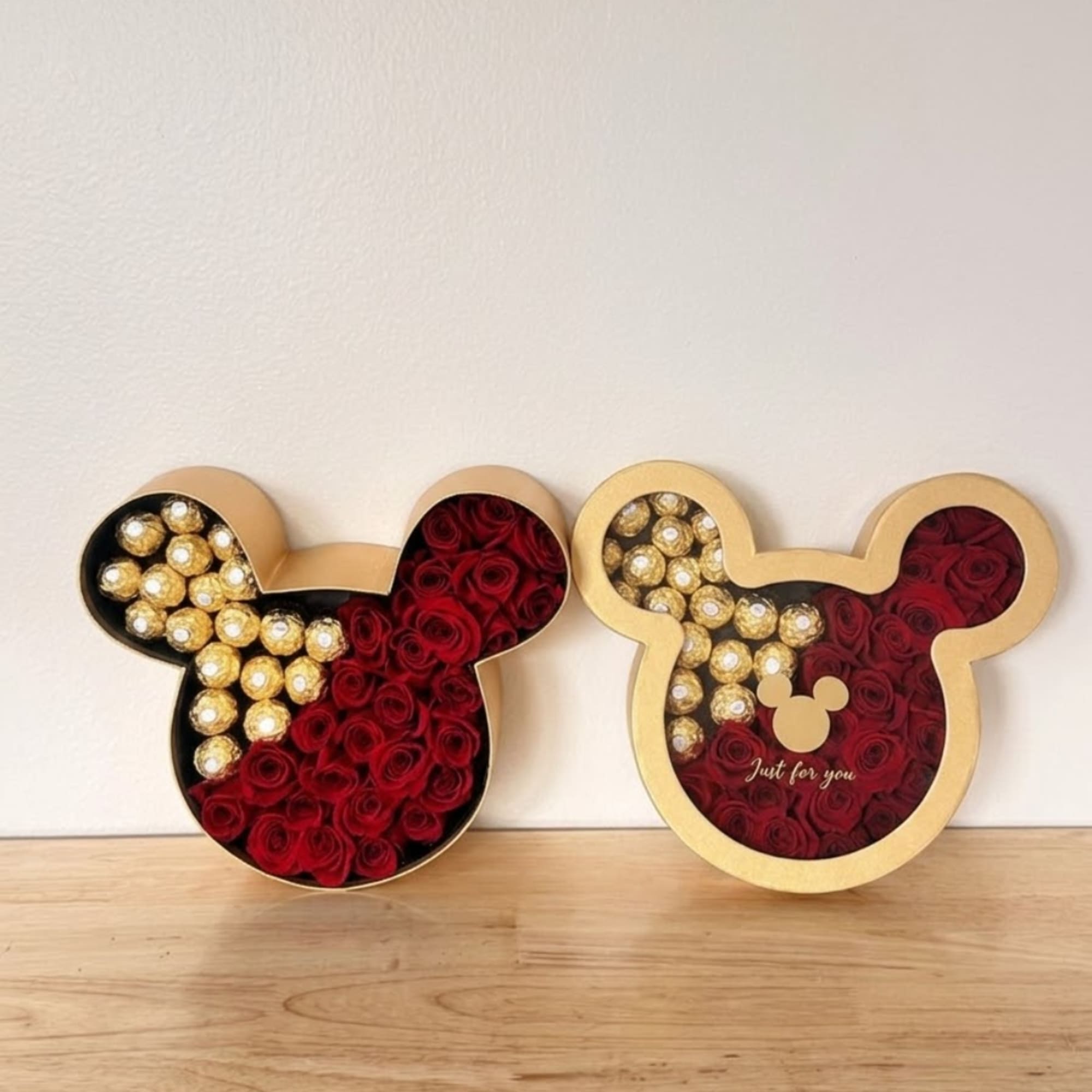 Mickey-shaped boxes filled with red roses and gold chocolates