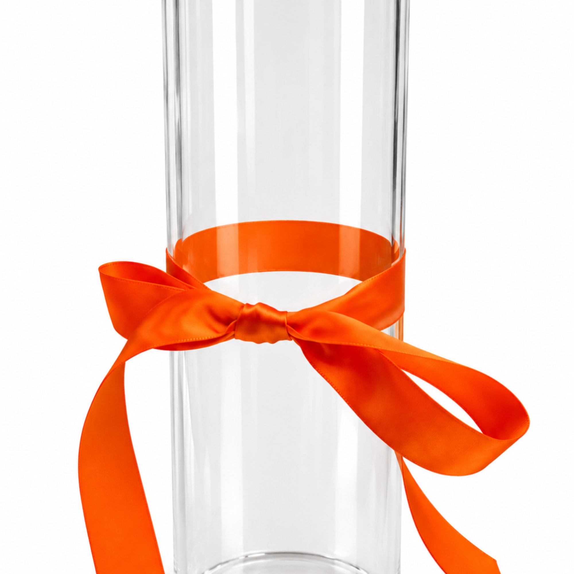 Clear glass cylinder vase tied with an orange ribbon bow