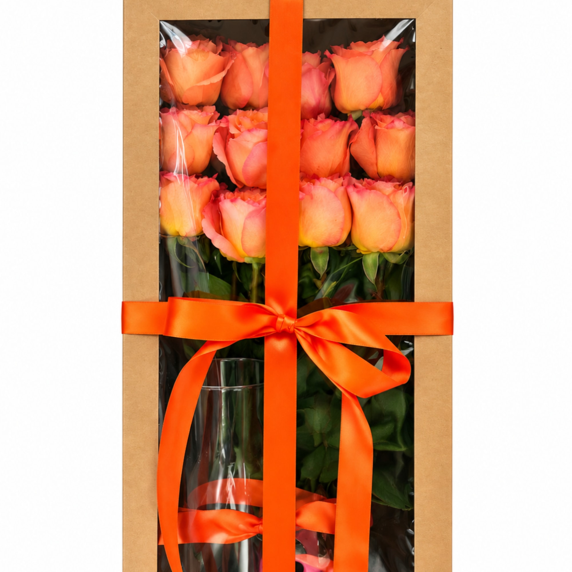 Boxed bouquet of peach and pink roses with an orange ribbon