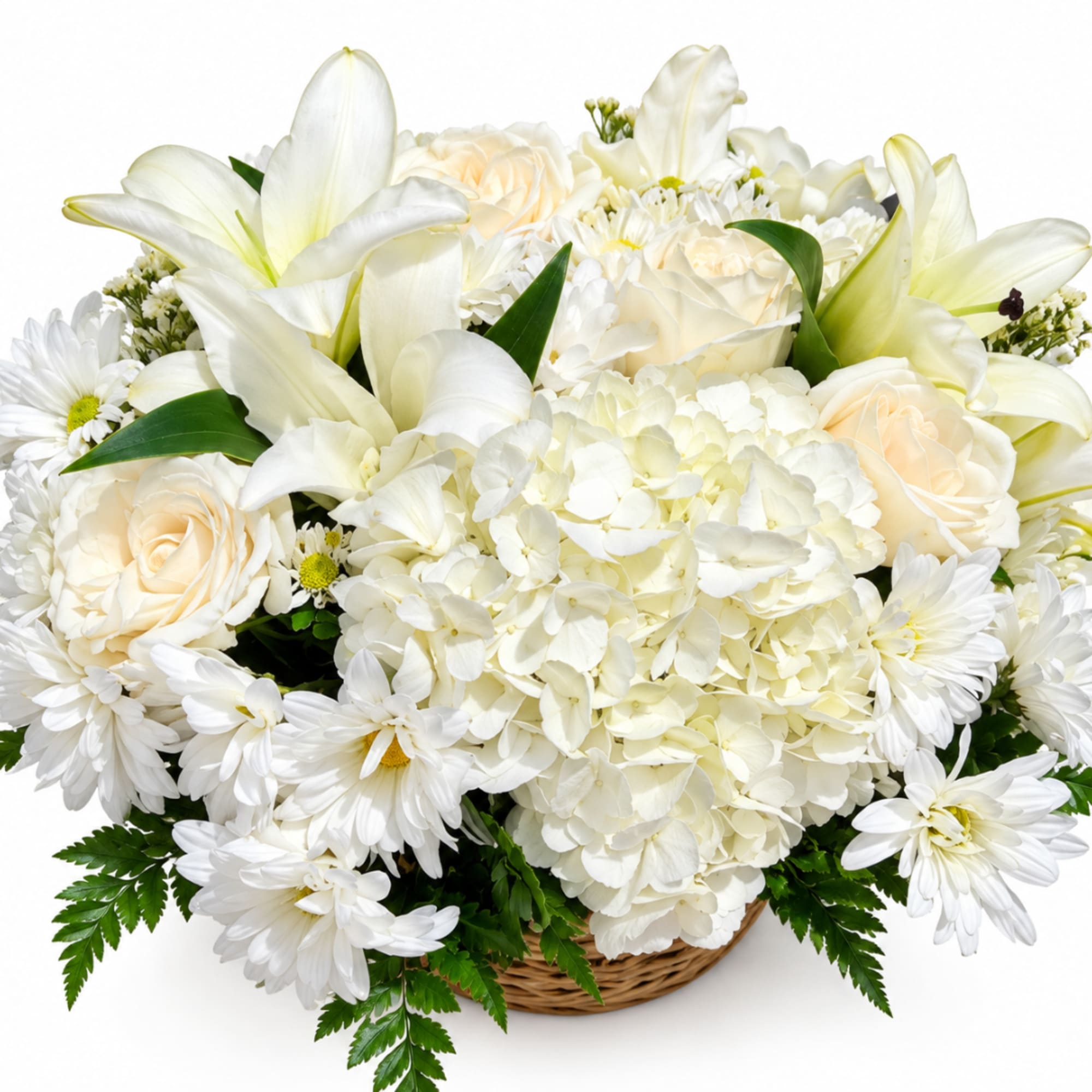 White lilies, roses, hydrangea, and daisies in a wicker basket