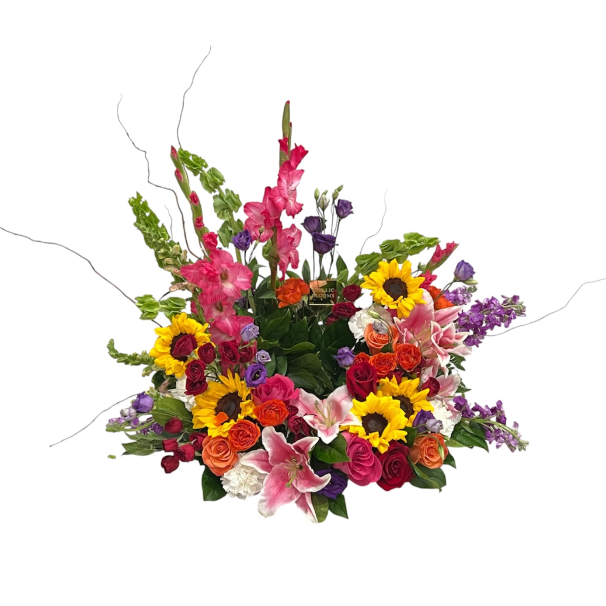 Colorful mixed flower arrangement with sunflowers, roses, lilies, and tall pink spikes