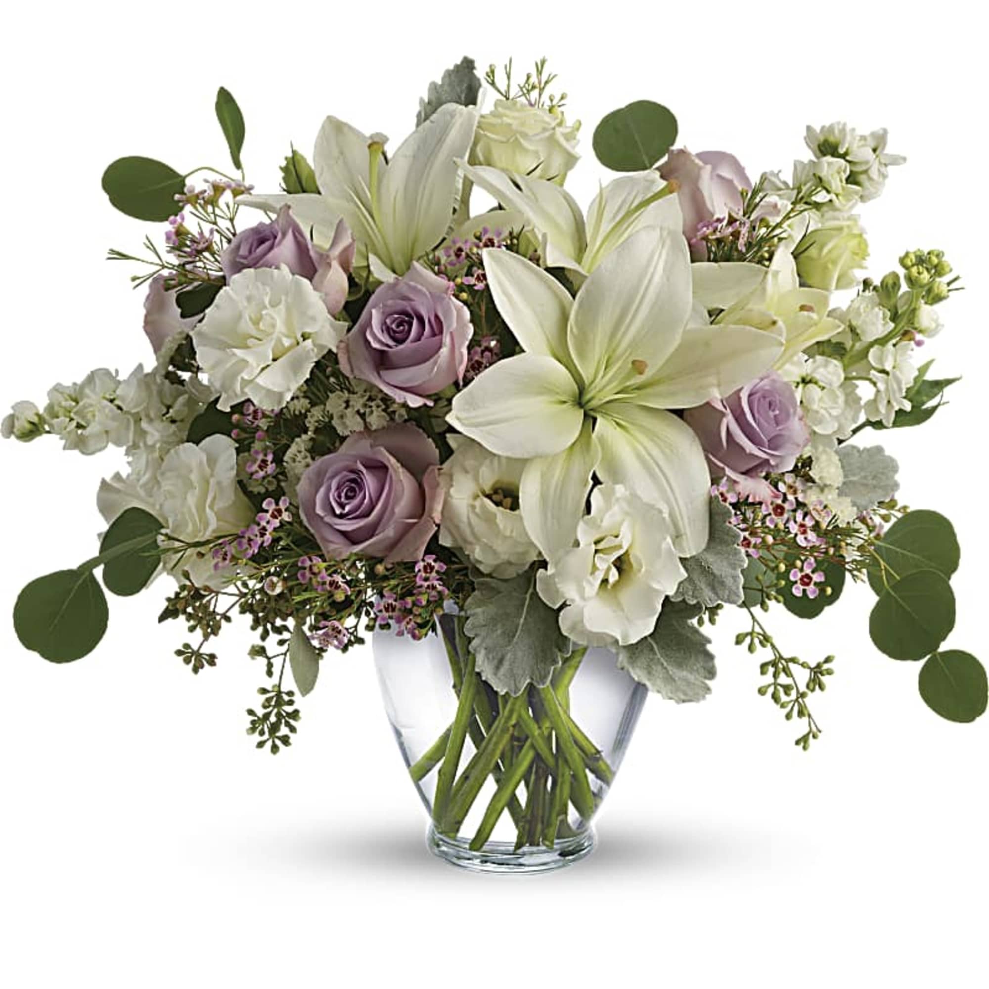 Lavender roses and white lilies in a clear glass vase