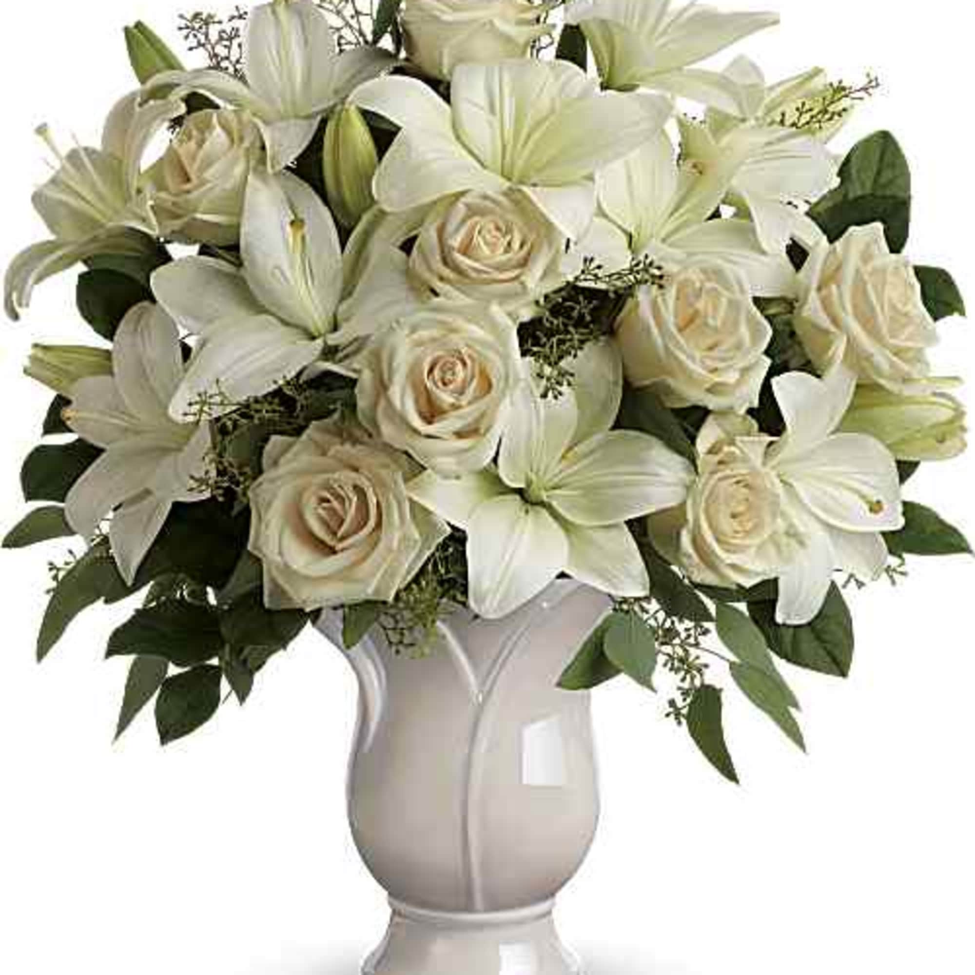 Celebrate a wondrous life with this timeless tribute of pure white lilies