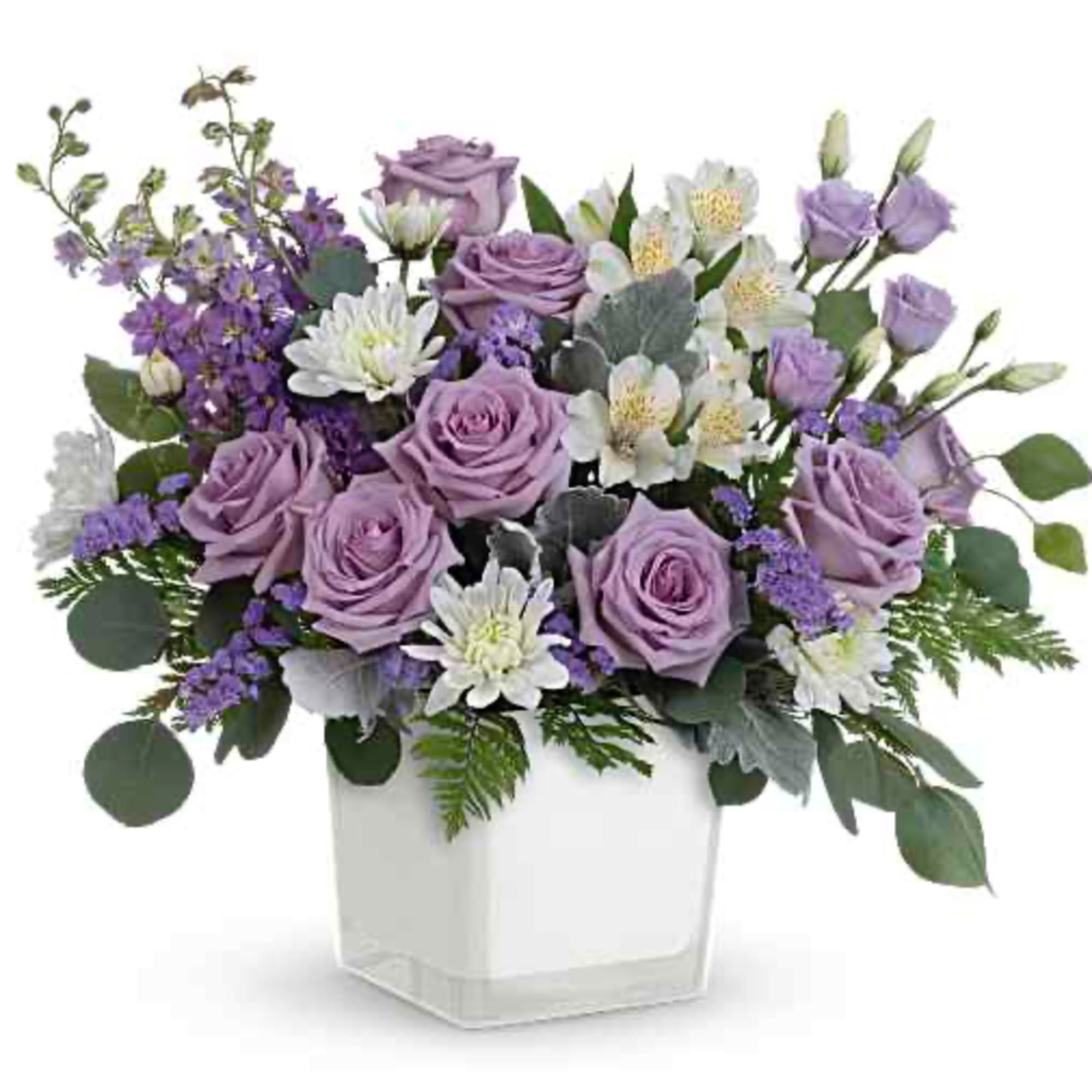 Lavender roses and white flowers in a white square vase