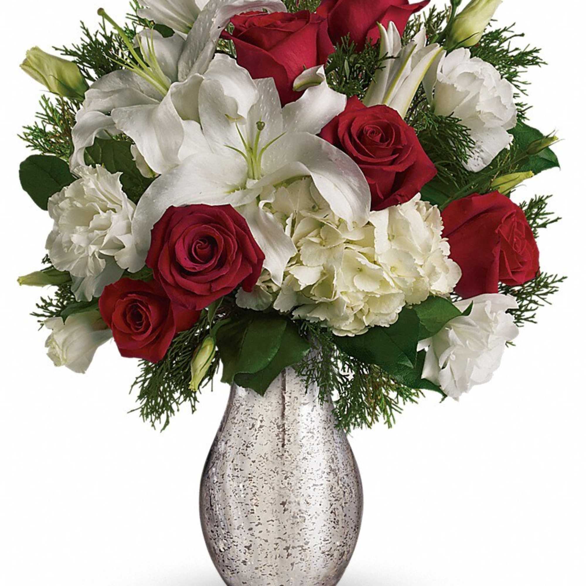 Red roses and white lilies arranged in a silver vase