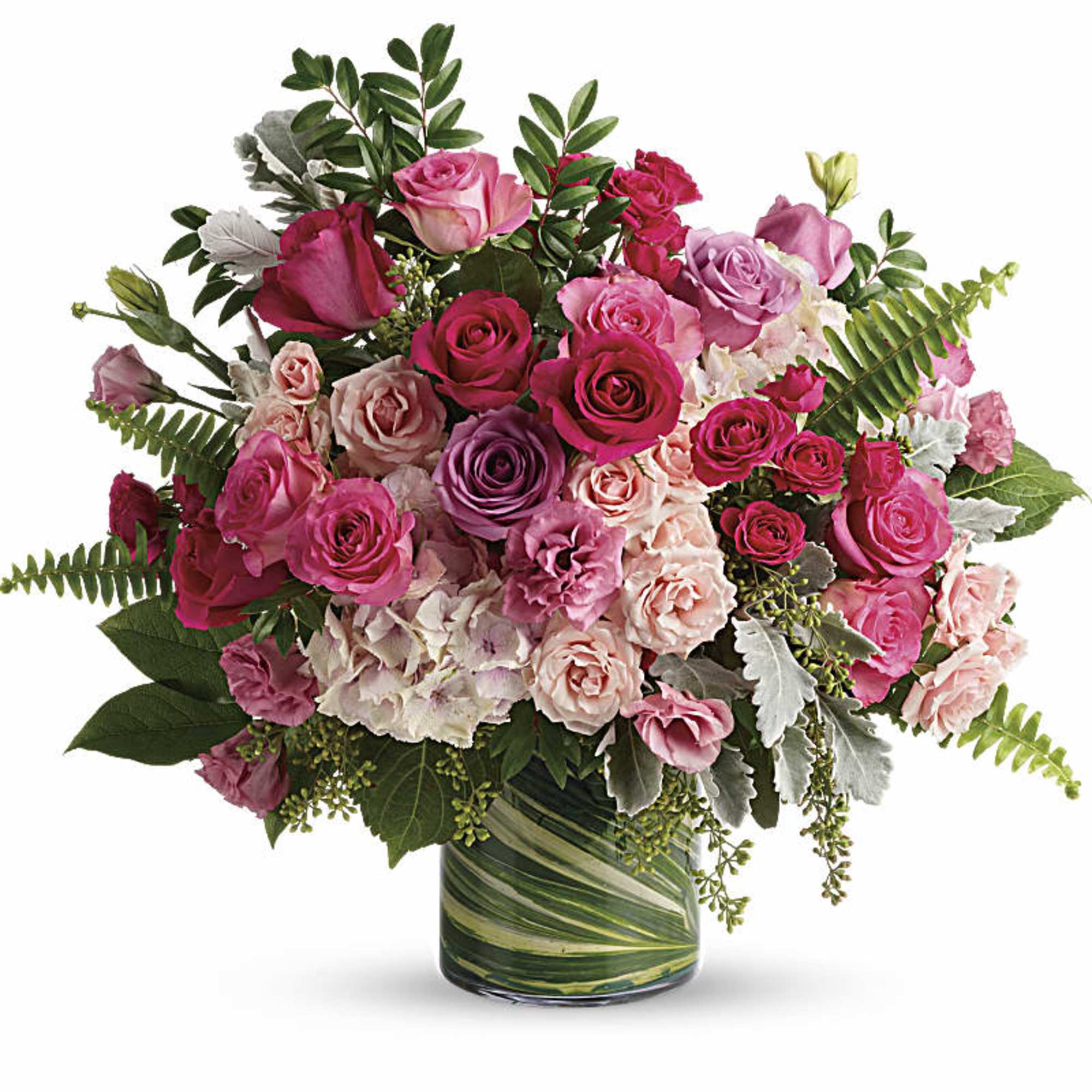 Pink and lavender rose bouquet in a green glass vase