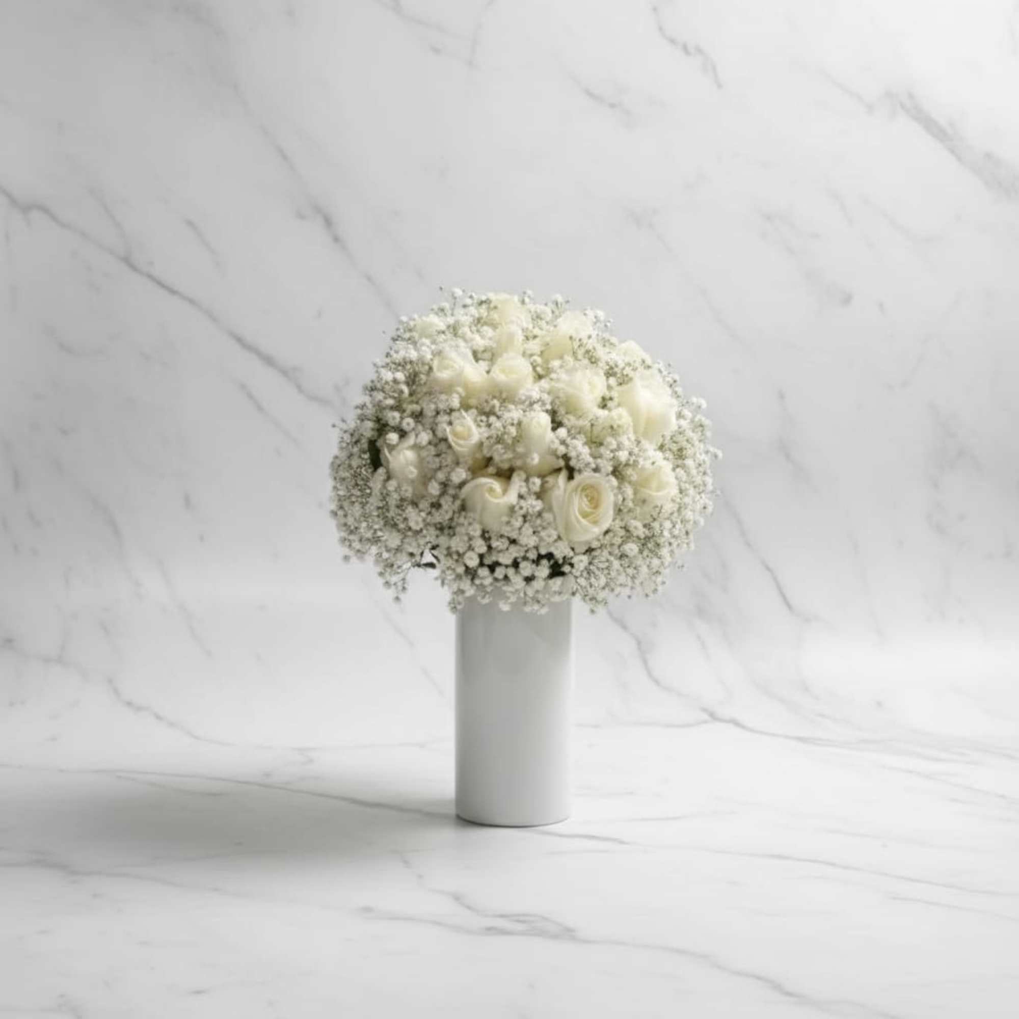 Soft, pure, and effortlessly elegant. this breathtaking arrangement features fresh white roses