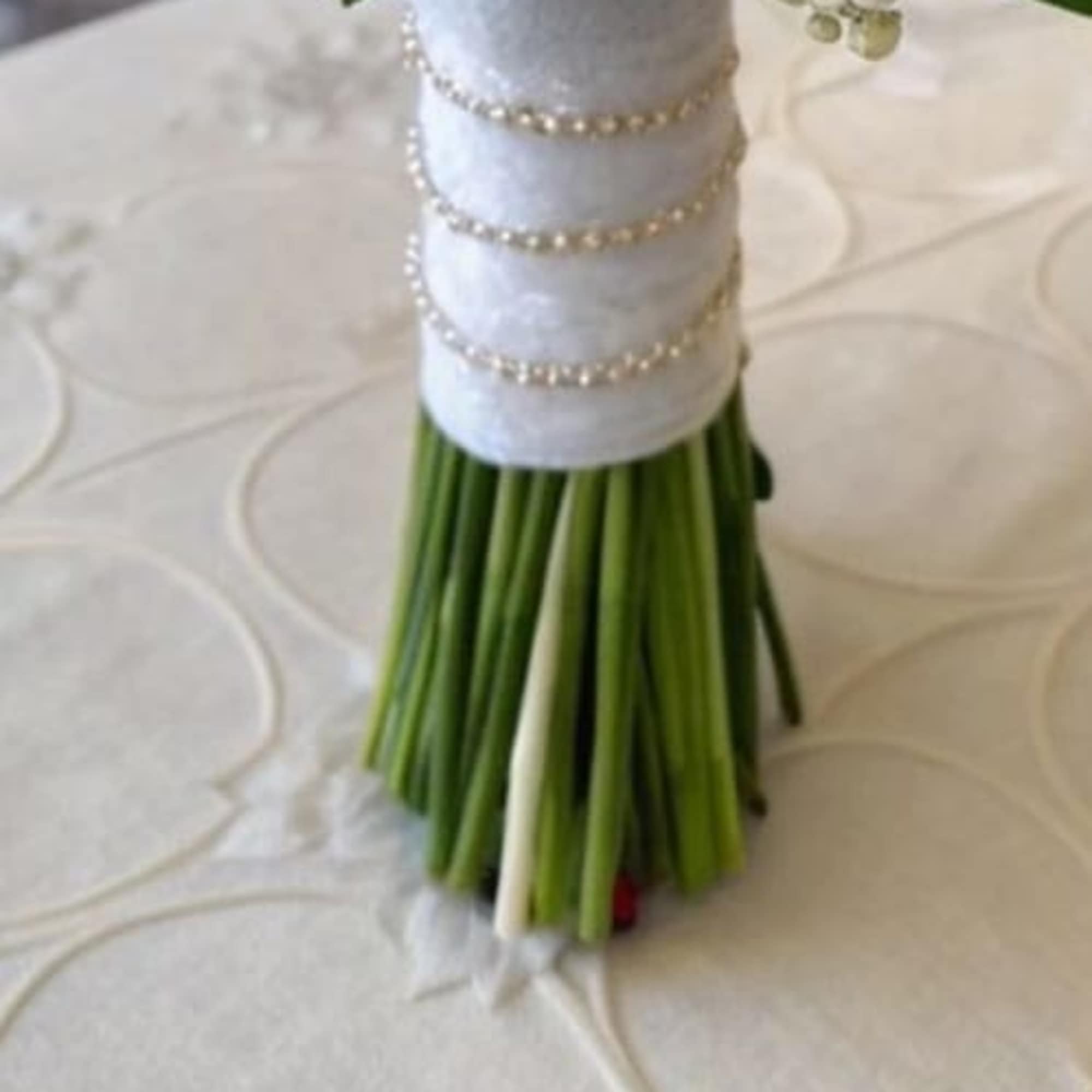 Soft, pure, and effortlessly elegant. this breathtaking arrangement features fresh white roses, photo 2 of 2