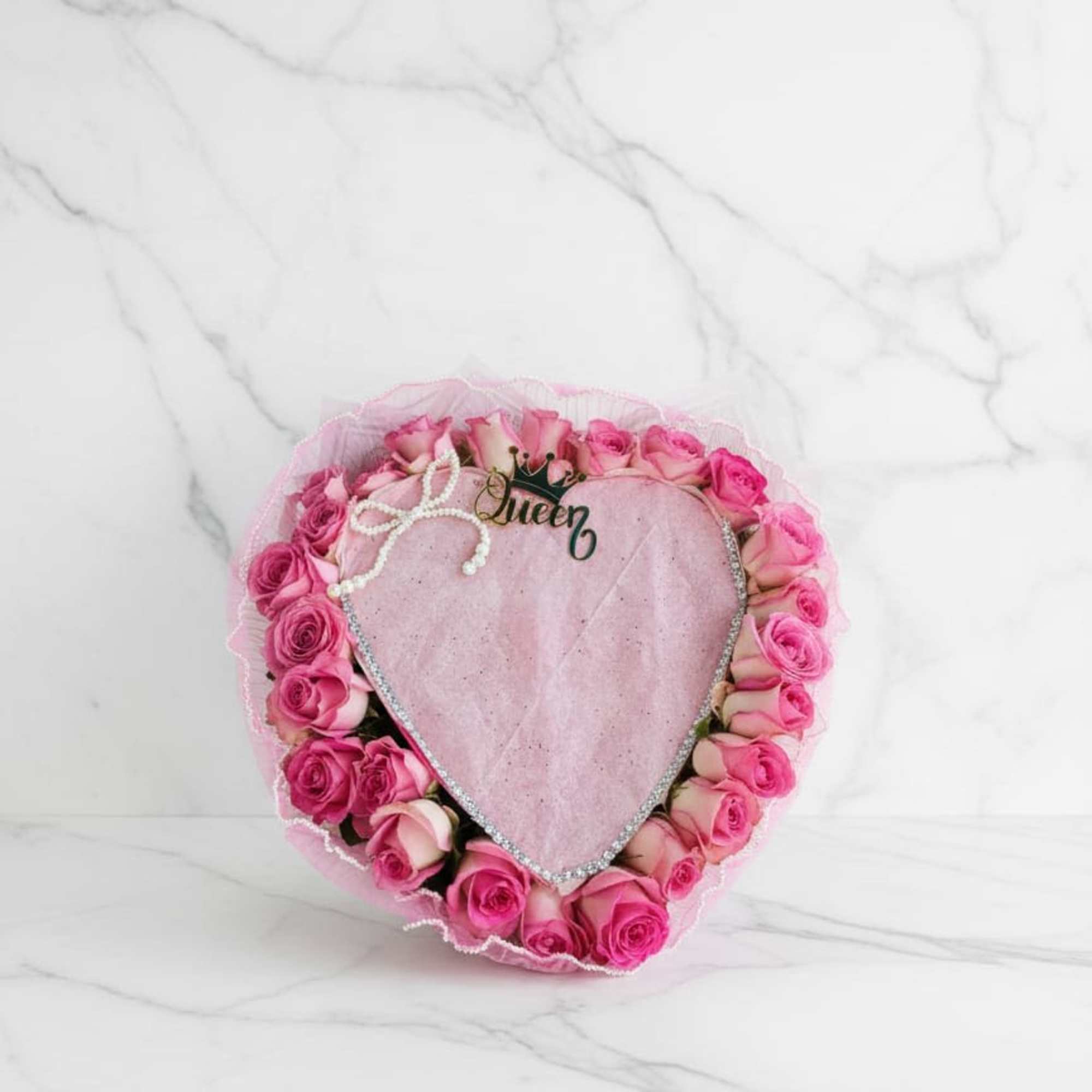 The elegant heart design symbolizes love and care, while the gentle pink