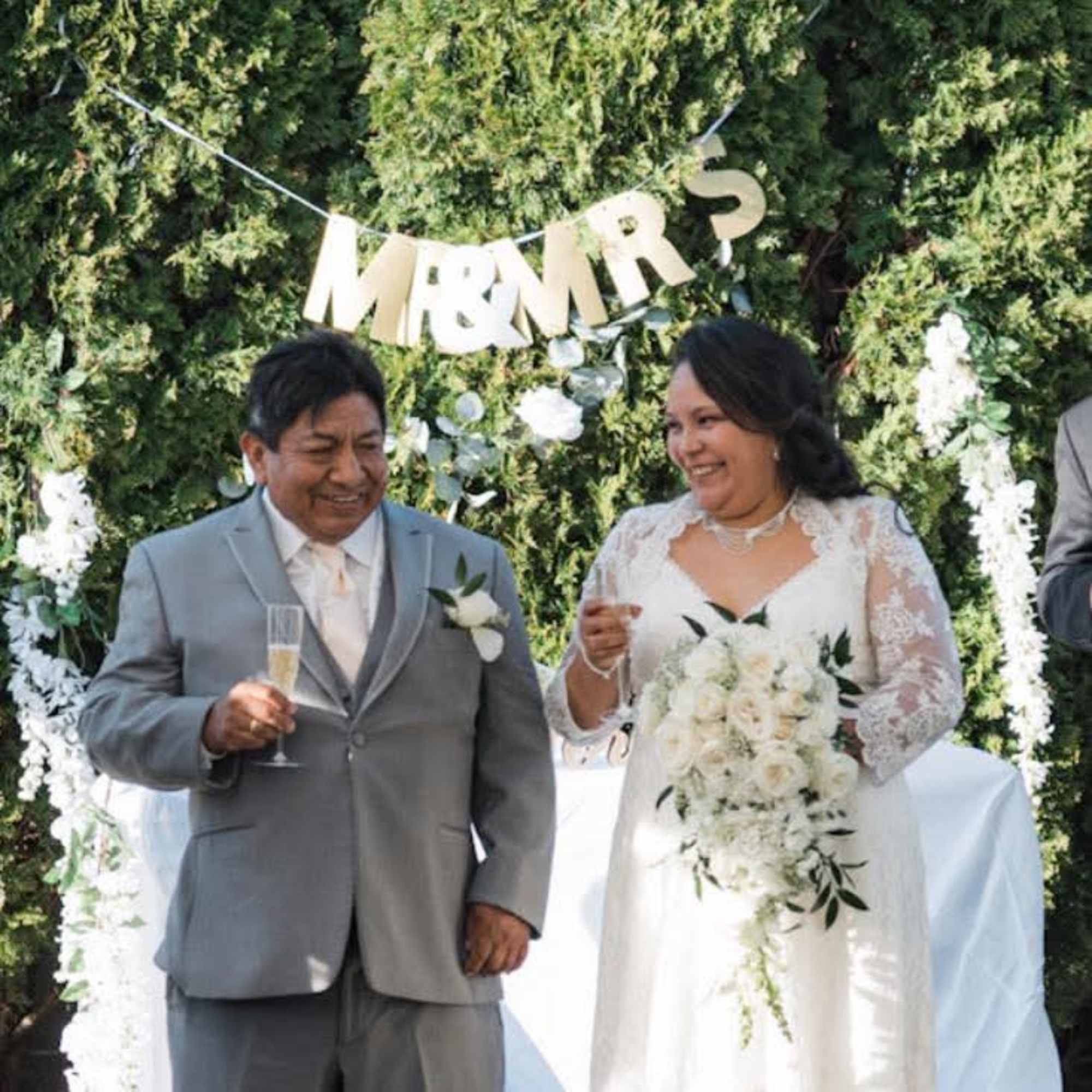 Hand-tied in a loose, flowing style, the bouquet showcases beautiful white roses, photo 2 of 2