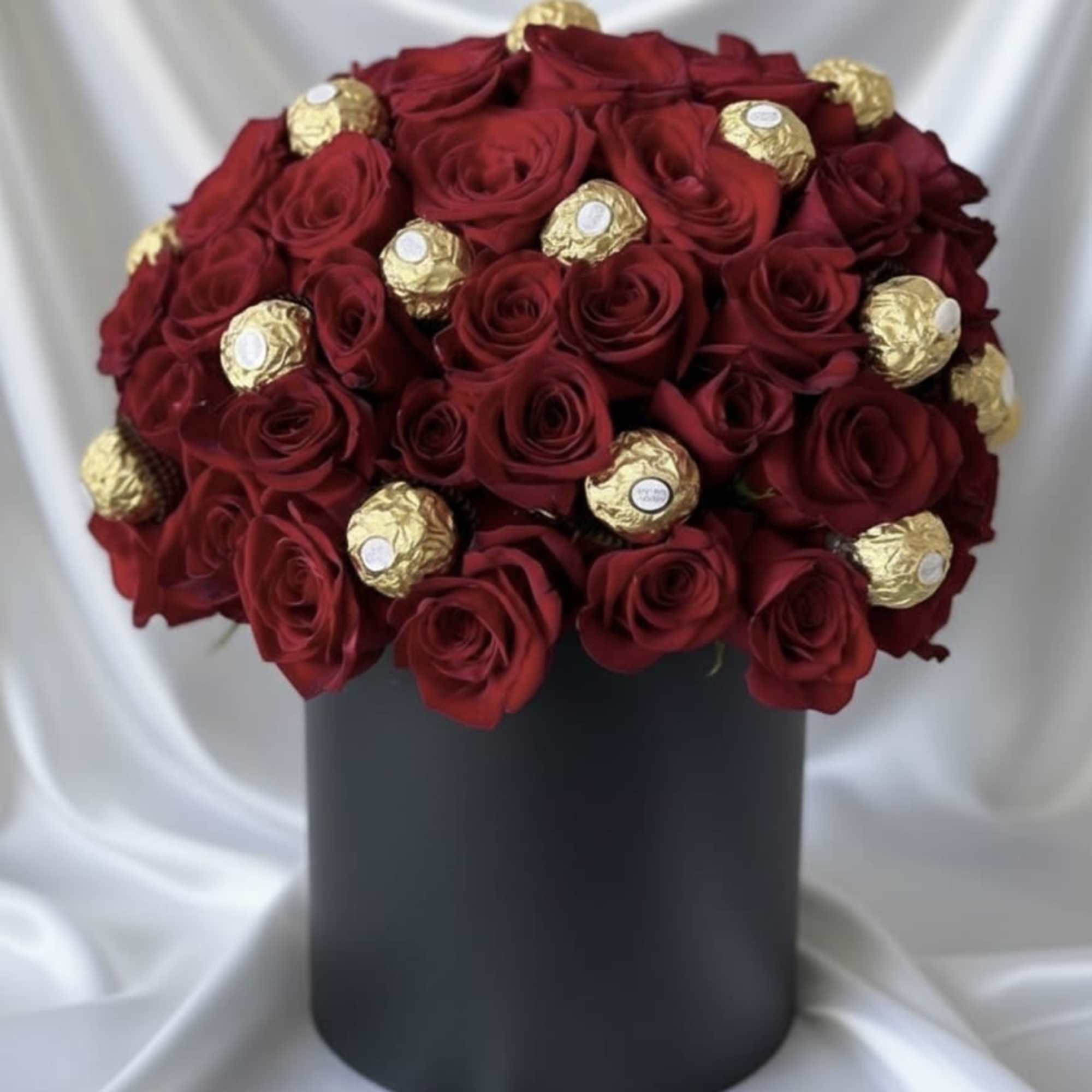 Luxury fresh rose dome elegantly paired with premium chocolate truffles, arranged in