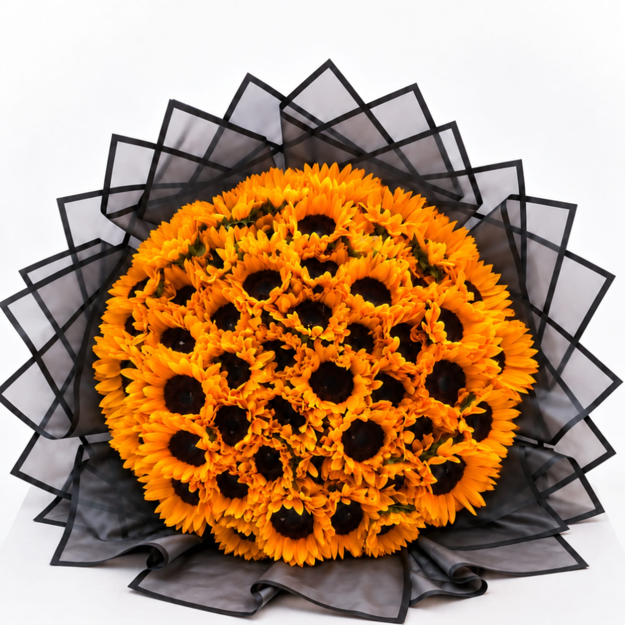 Bouquet of orange sunflowers wrapped in black paper