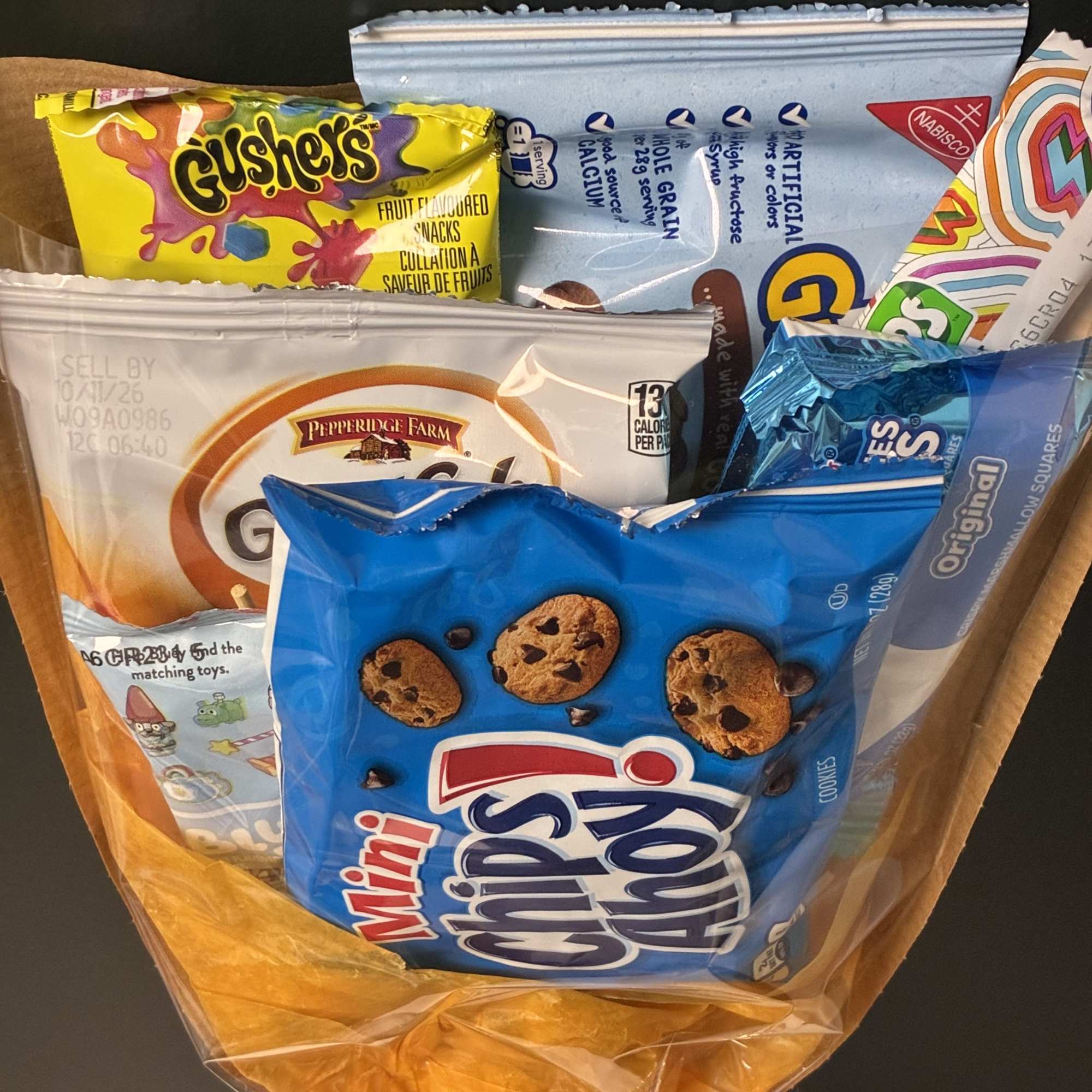 A fun and colorful arrangement filled with kid-favorite snacks and sweet treats!, photo 2 of 2