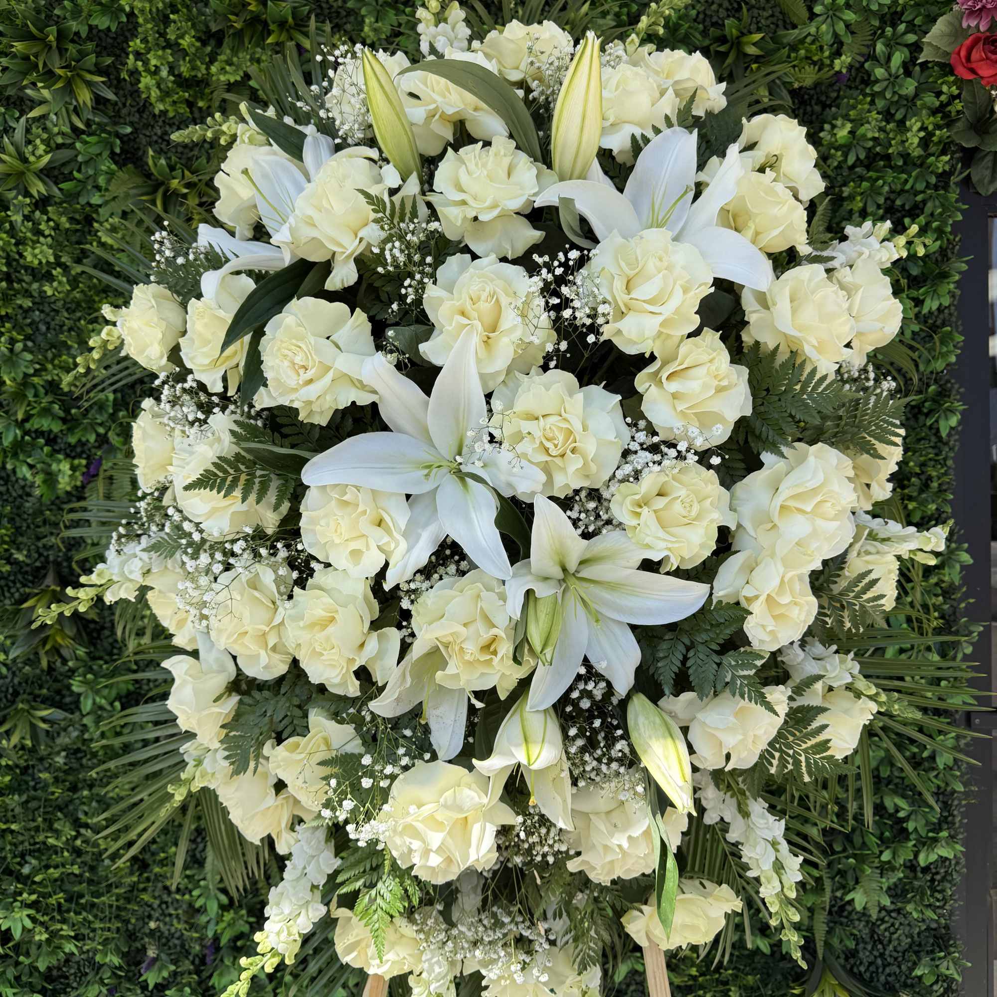 A graceful arrangement of pure white flowers, symbolizing peace, remembrance, and eternal