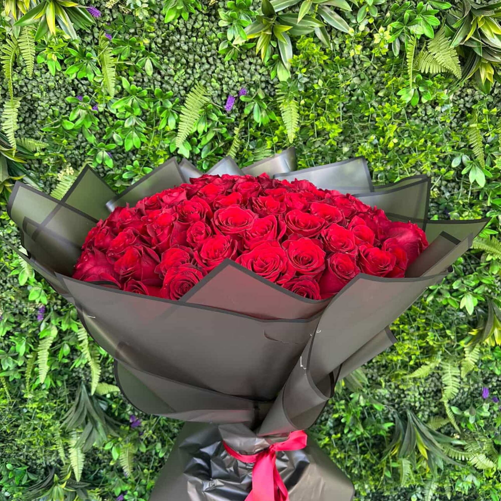 A luxurious bouquet OF stunning red roses, each carefully selected and arranged